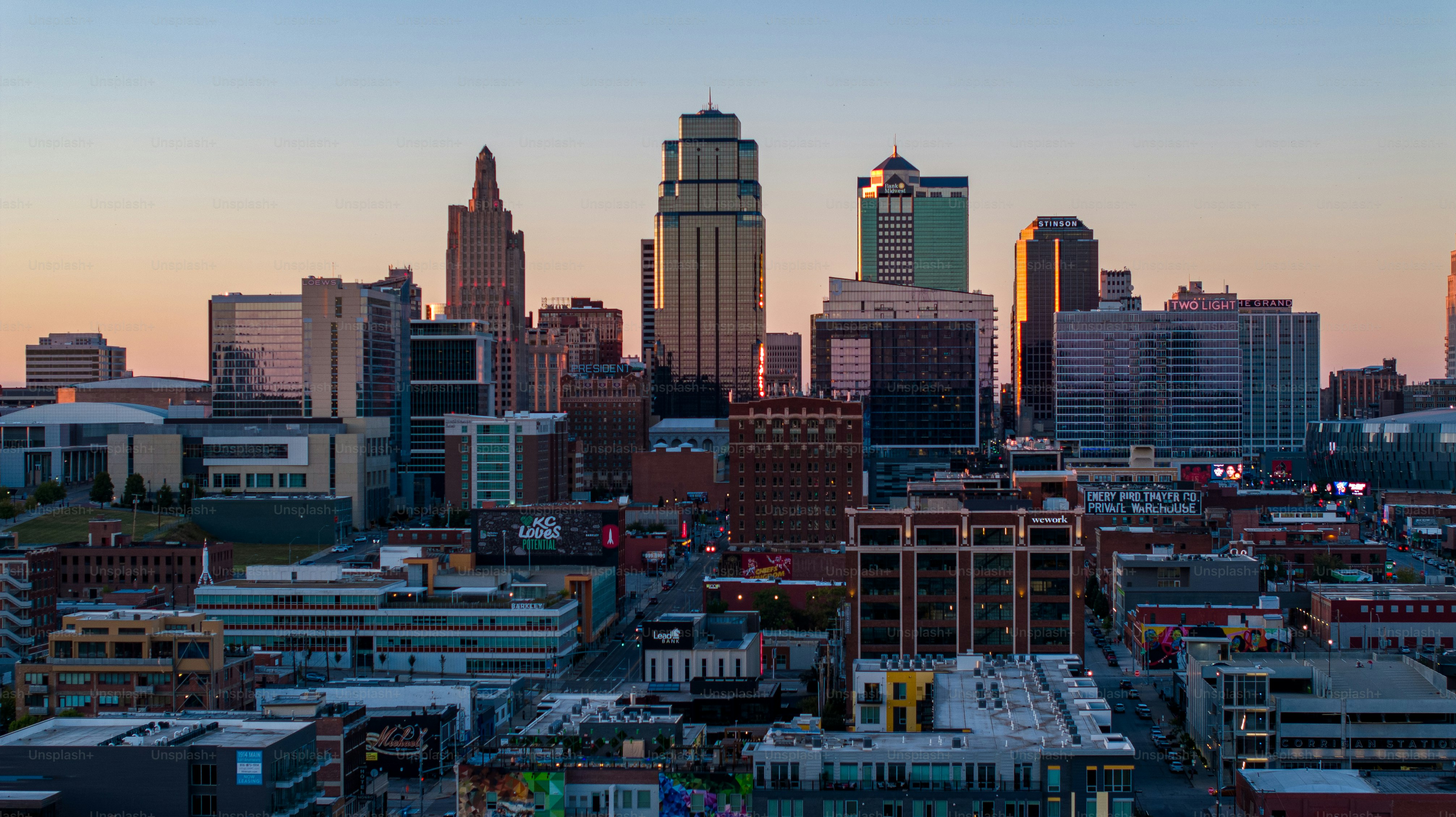 Drone shot of Downtown Kansas City skyscrapers at sunset.
