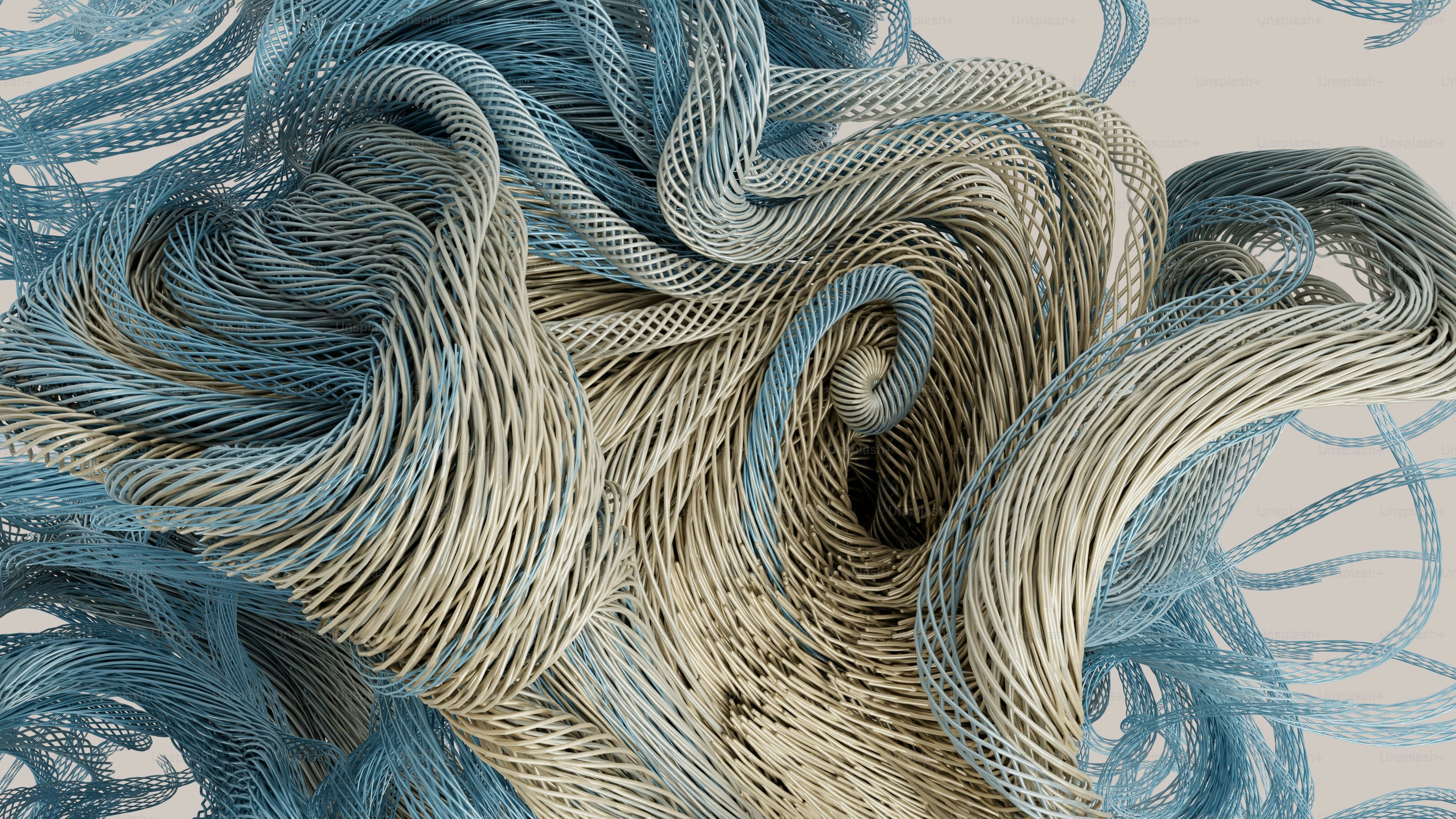 Swirling blue and beige textured cables forming an abstract knot on a light background