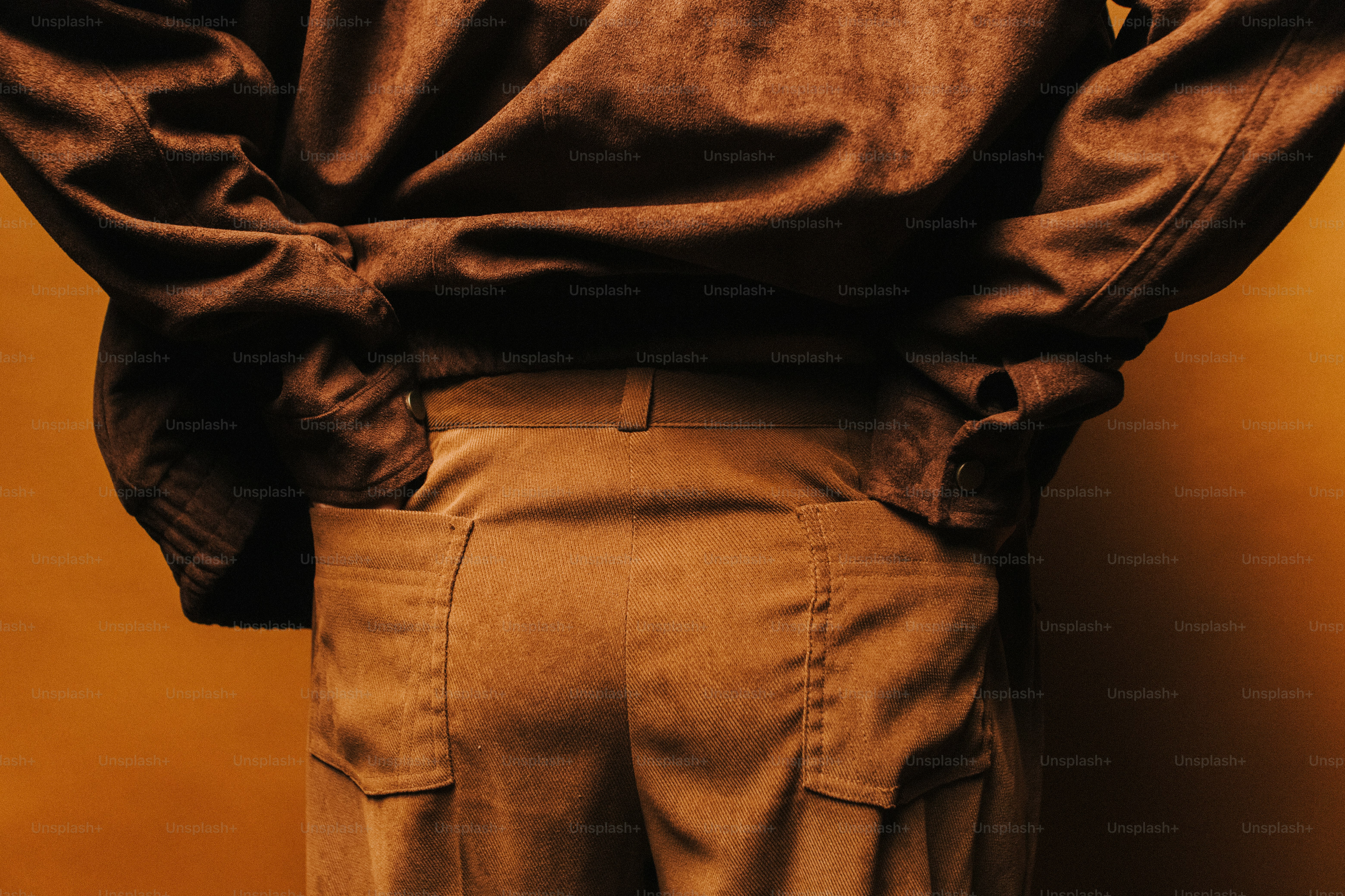 Person in brown jacket on bench - Photo on Unsplash+