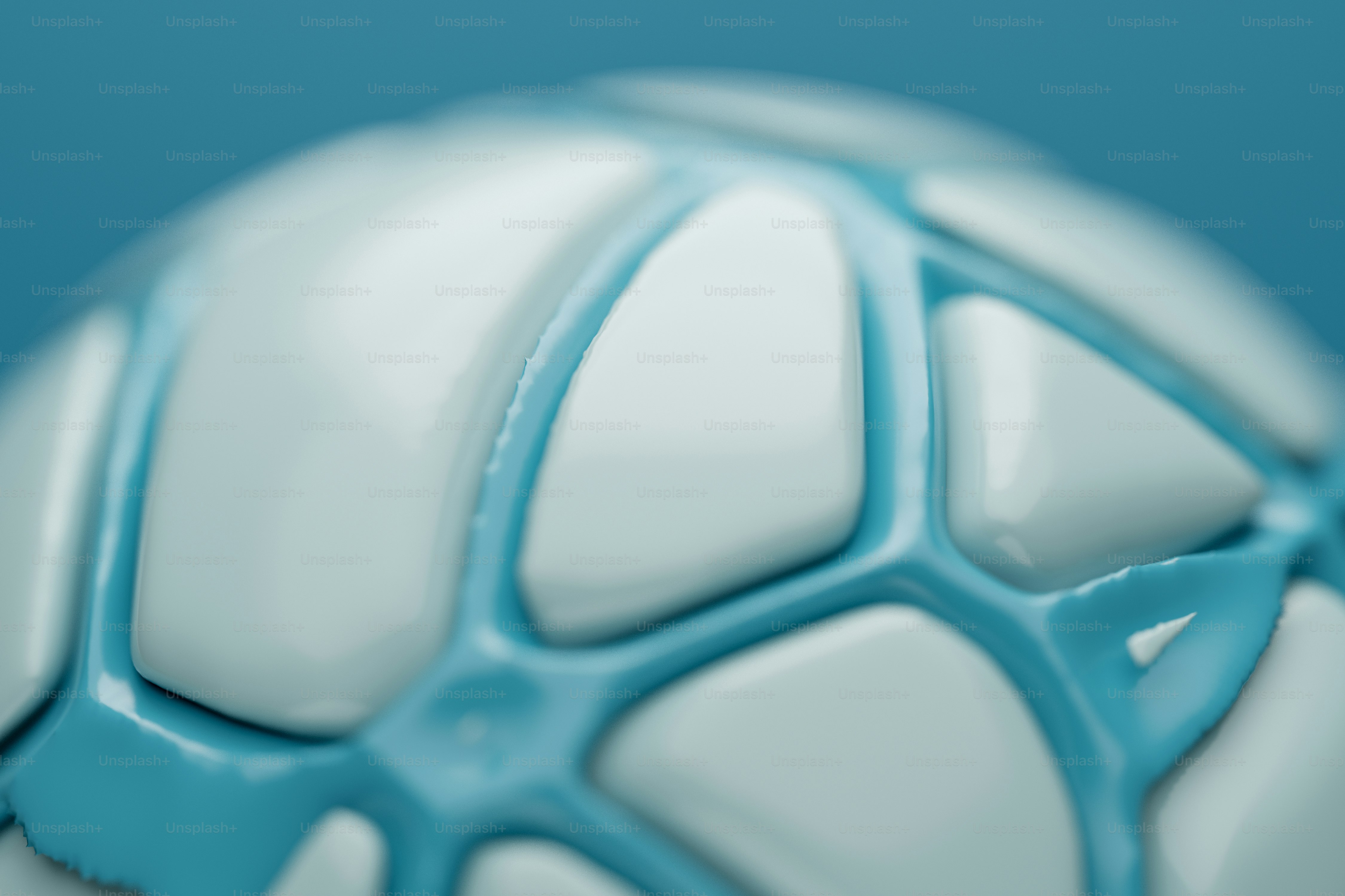 A close-up of a white and blue geometric sphere with rounded panels
