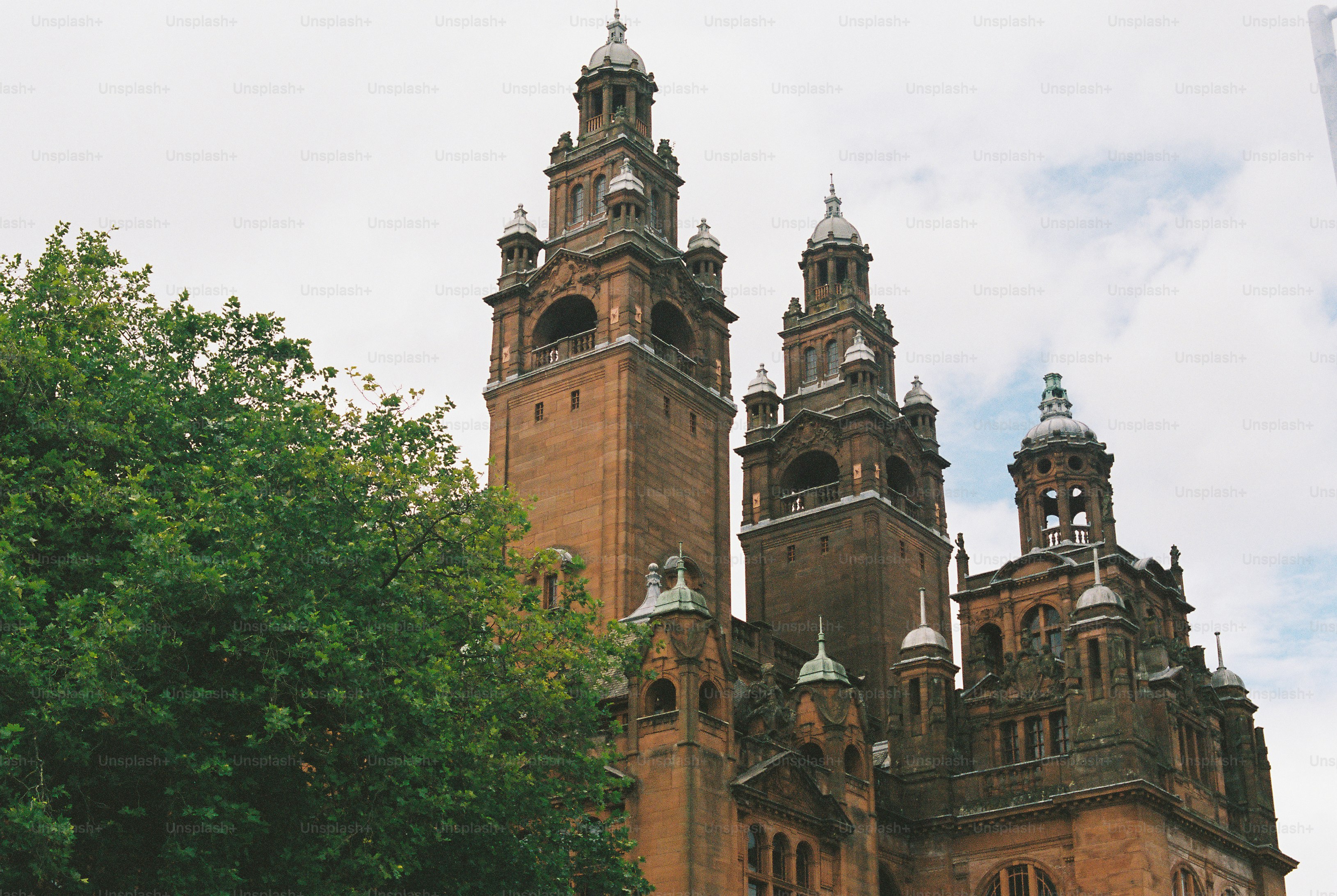 The Kelvingrove Art Gallery and Museum with its towers against a cloudy sky