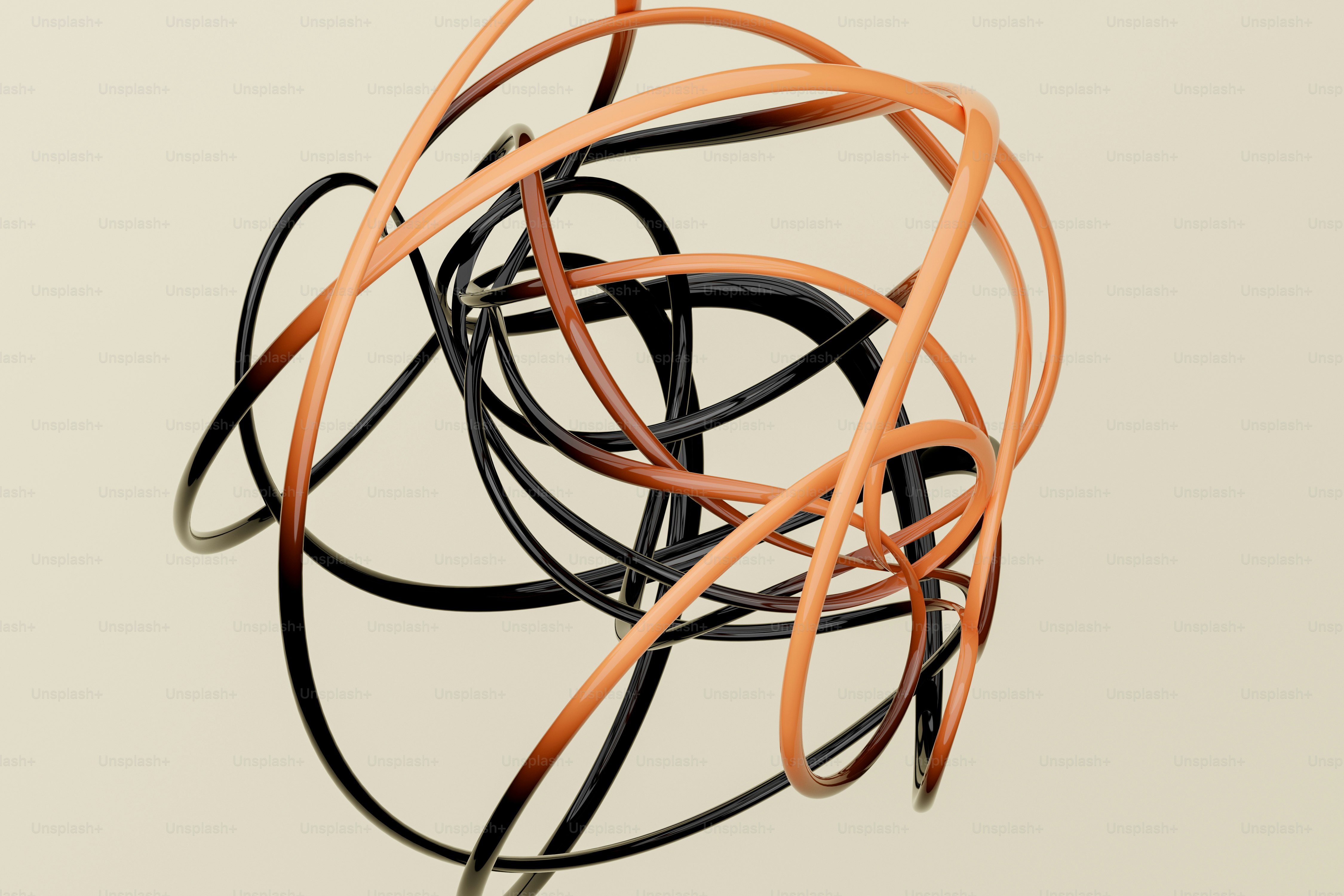Intertwined glossy black and orange rings forming a complex abstract shape