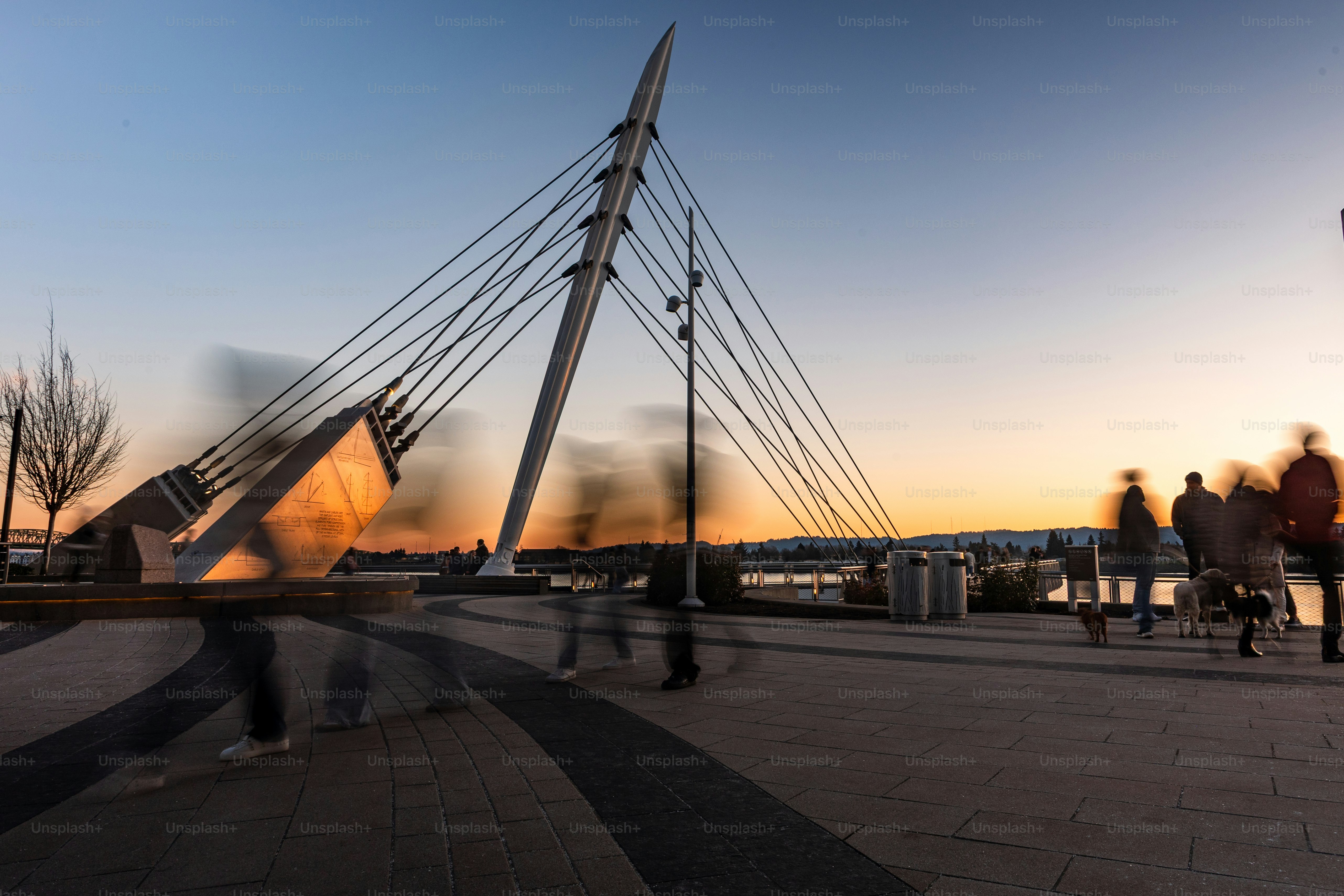 The Vancouver Washington Waterfront Park At Twilight, shot with a ND filter to slow the shutter speed and blur the people visiting the park. This is a popular location to visit in Vancouver, Washington, and the pier overlooks the Columbia River.