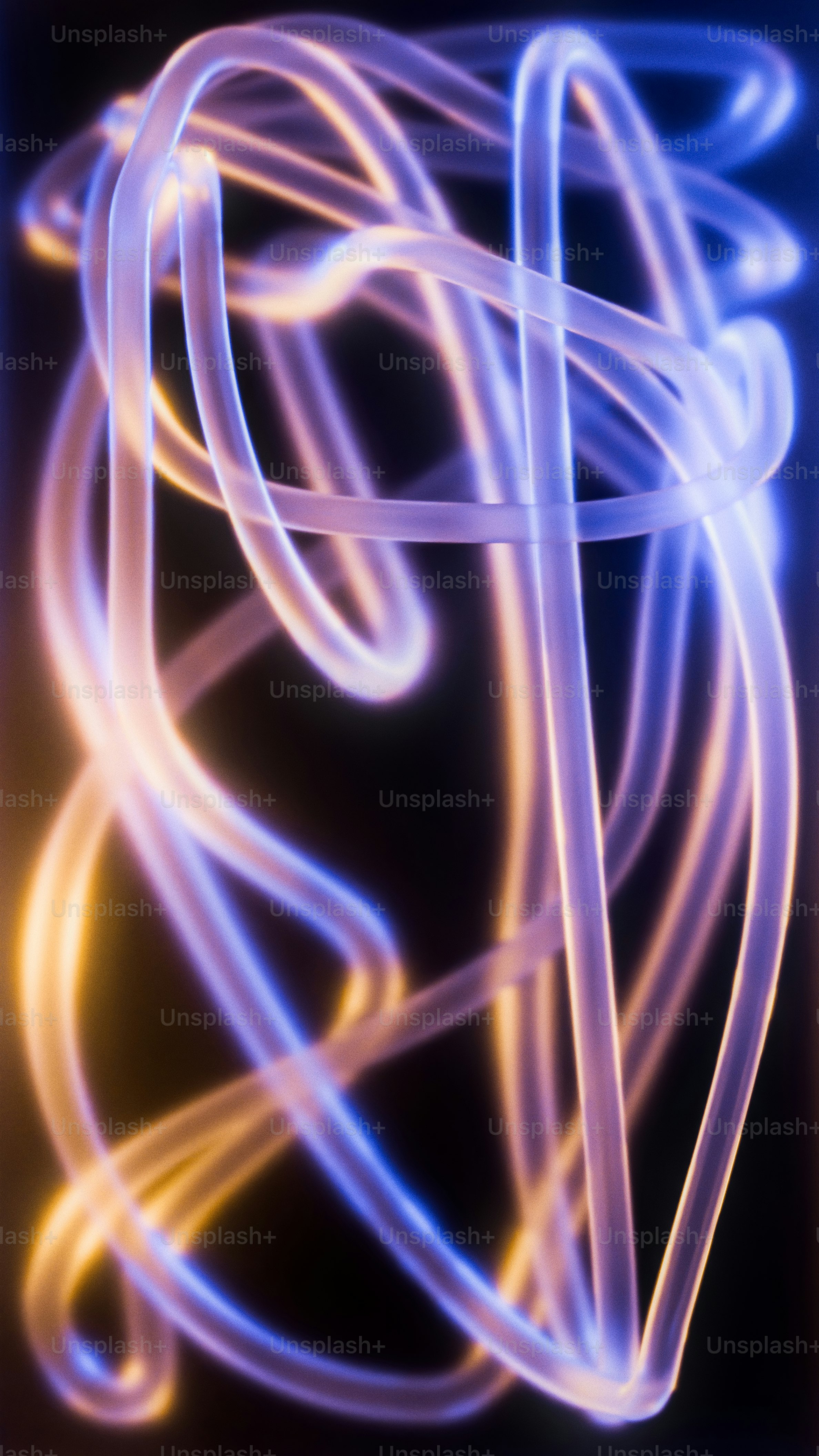 Translucent tubes glowing with blue and orange light against a dark background