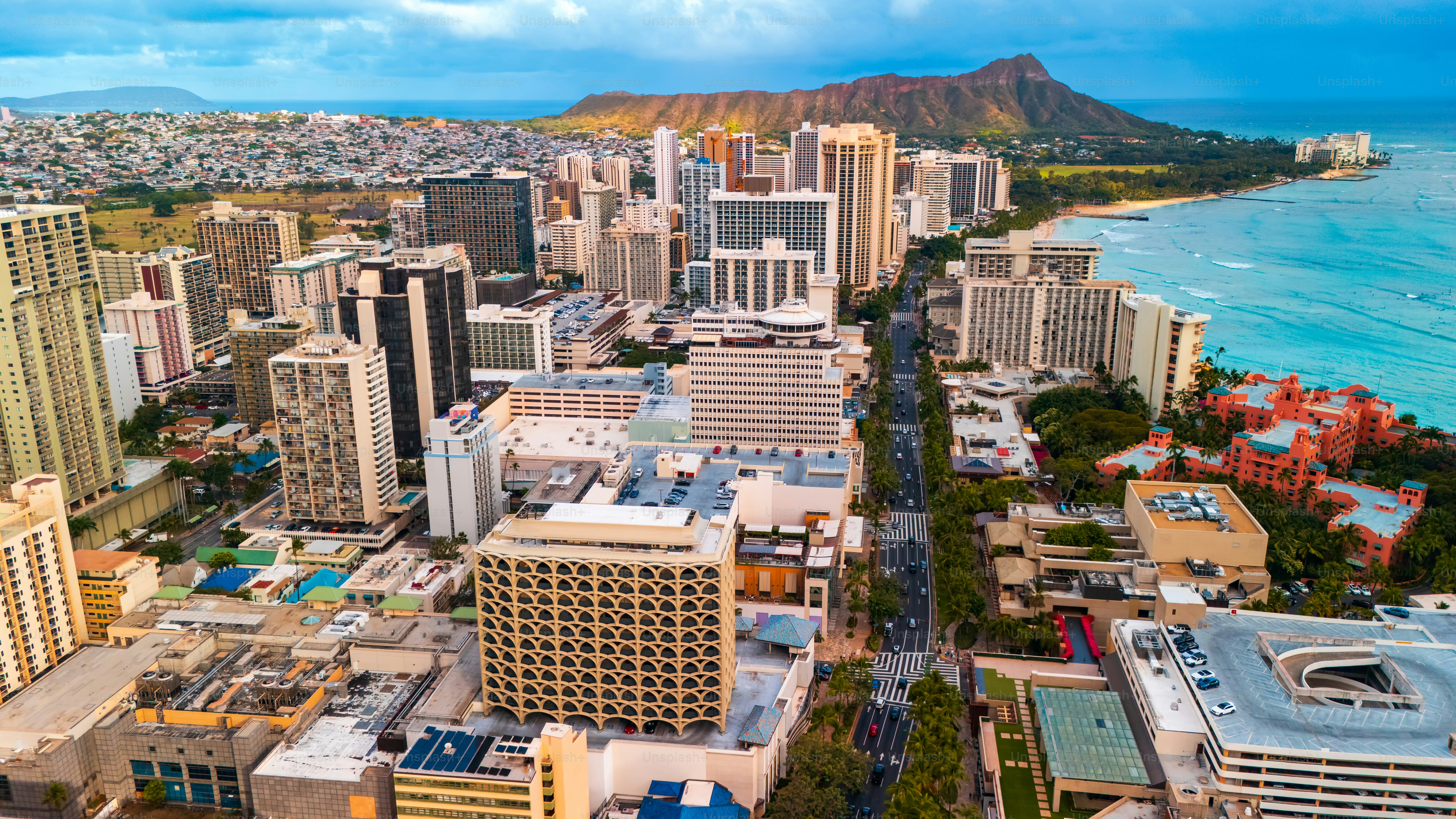 Beautiful panorama of Waikiki at the shore of the Pacific Ocean. Aerial perspective on the Diamond Head Crater and blue ocean waterscape.
