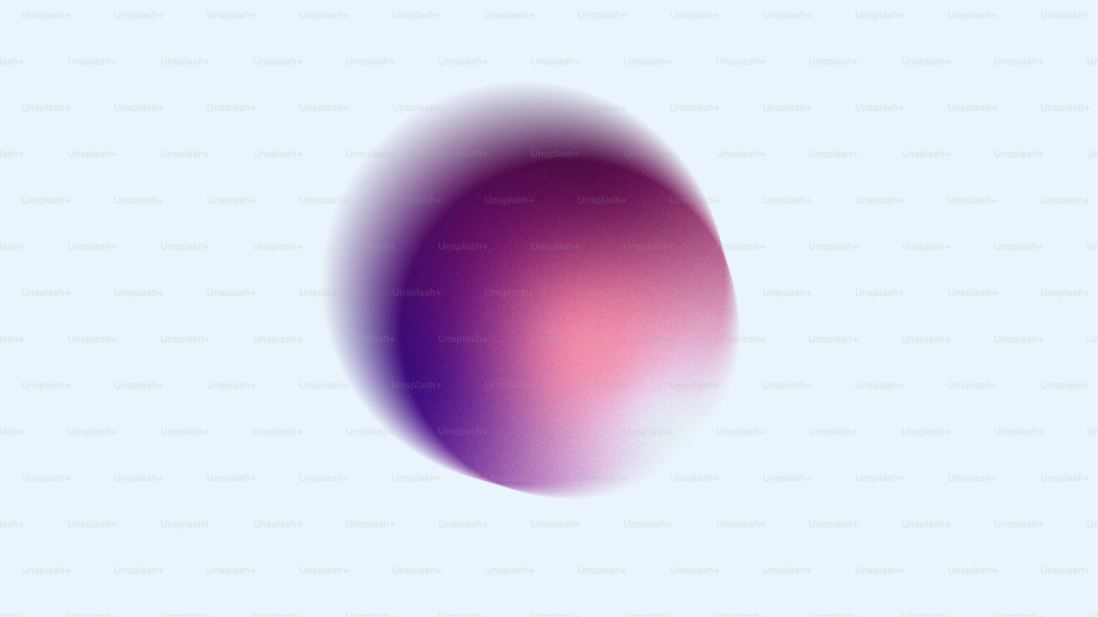 Un orbe degradado suave de color púrpura y rosa con textura granulada
