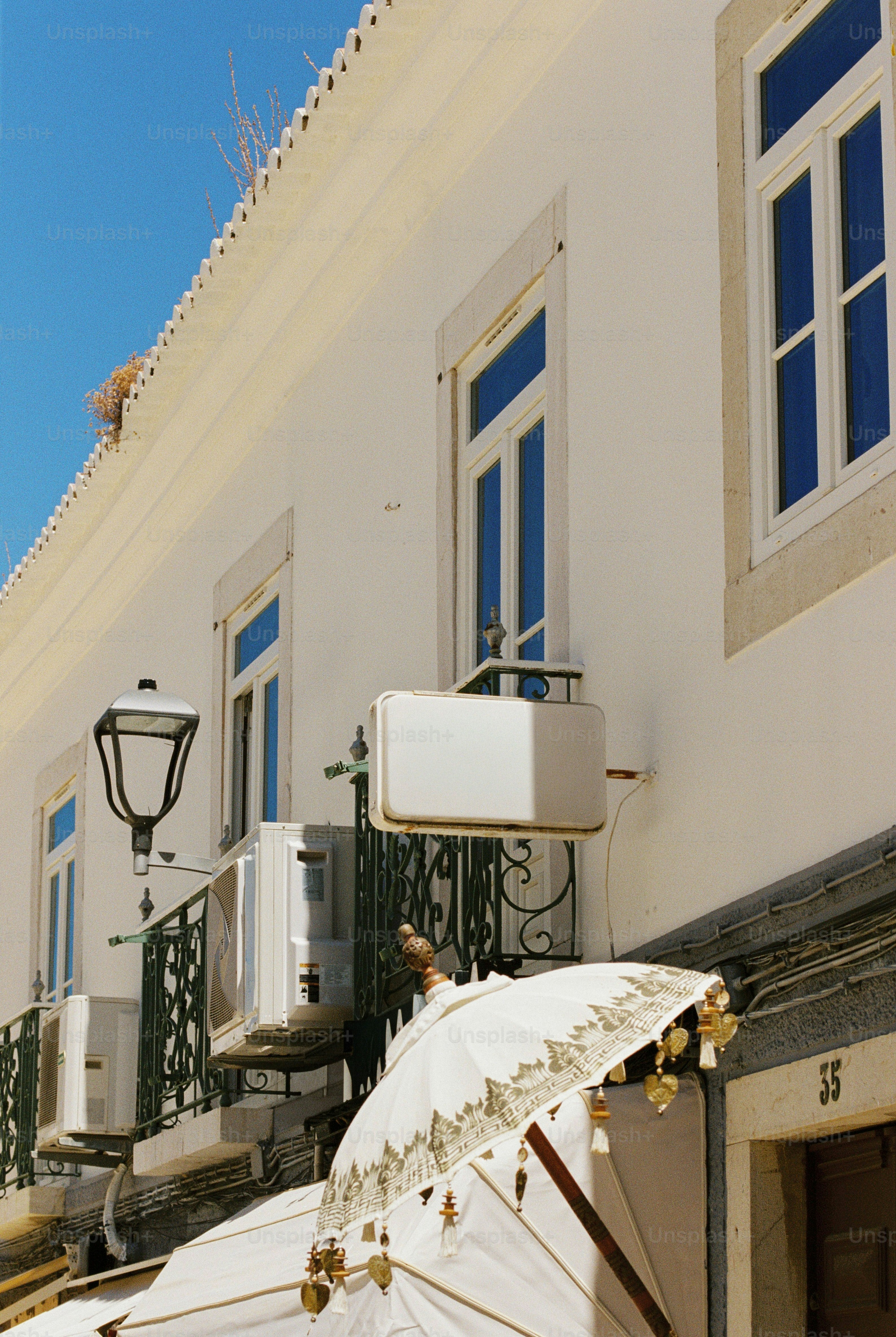 Blank sign on balcony in Lagos - Photo on Unsplash+
