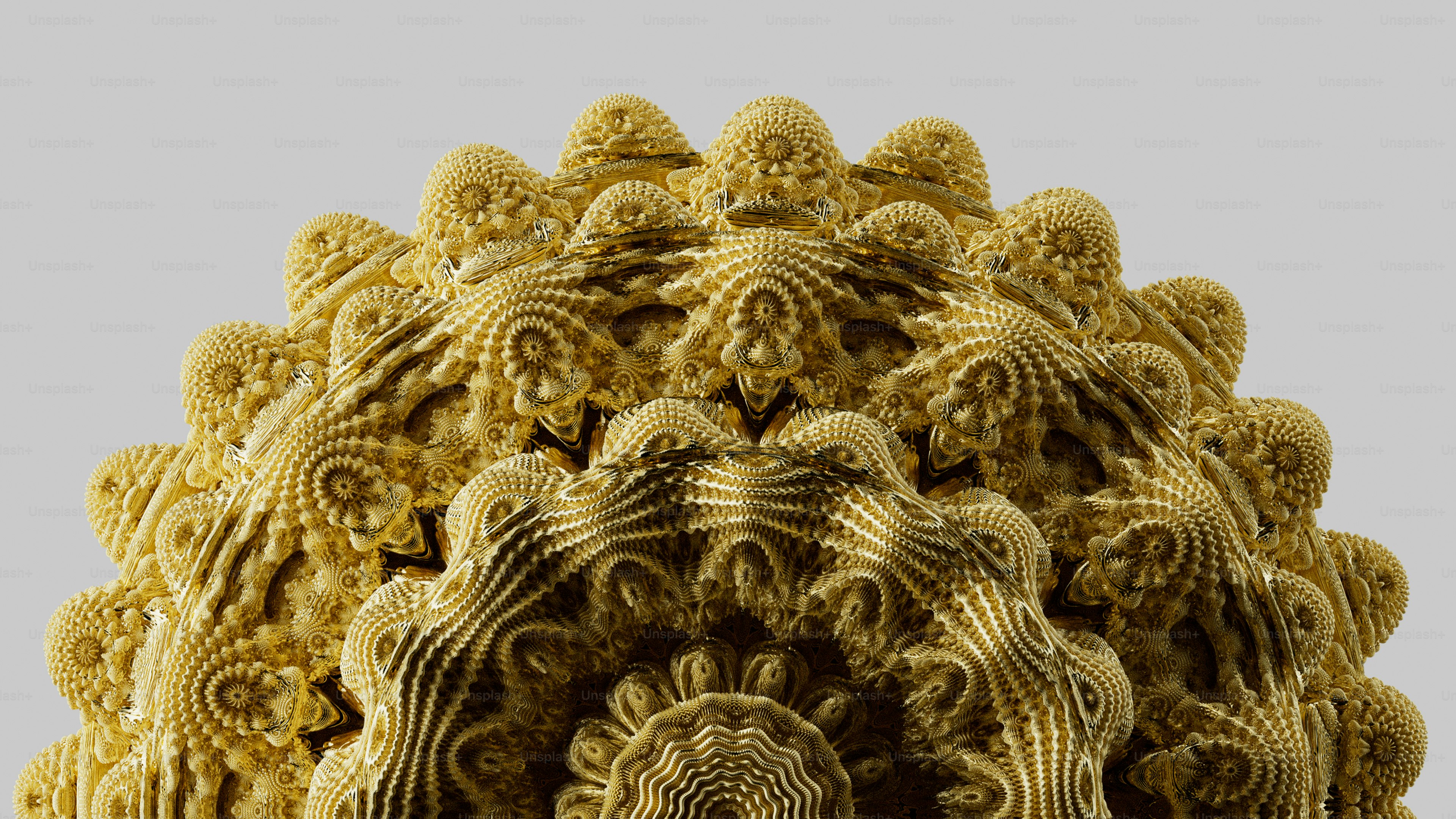 A complex golden fractal structure with intricate repeating patterns against a light background