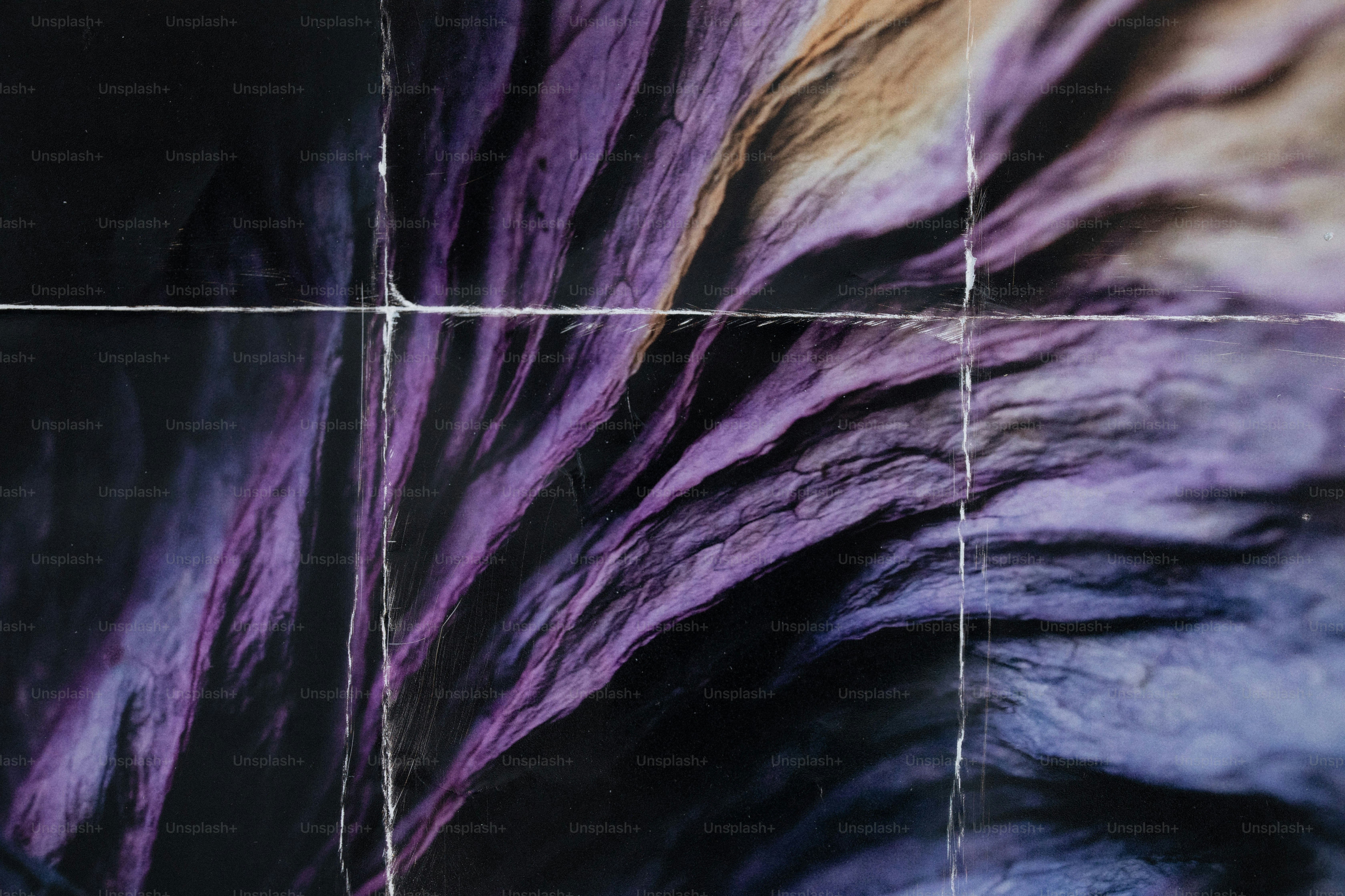 A creased purple and black abstract texture with white grid lines