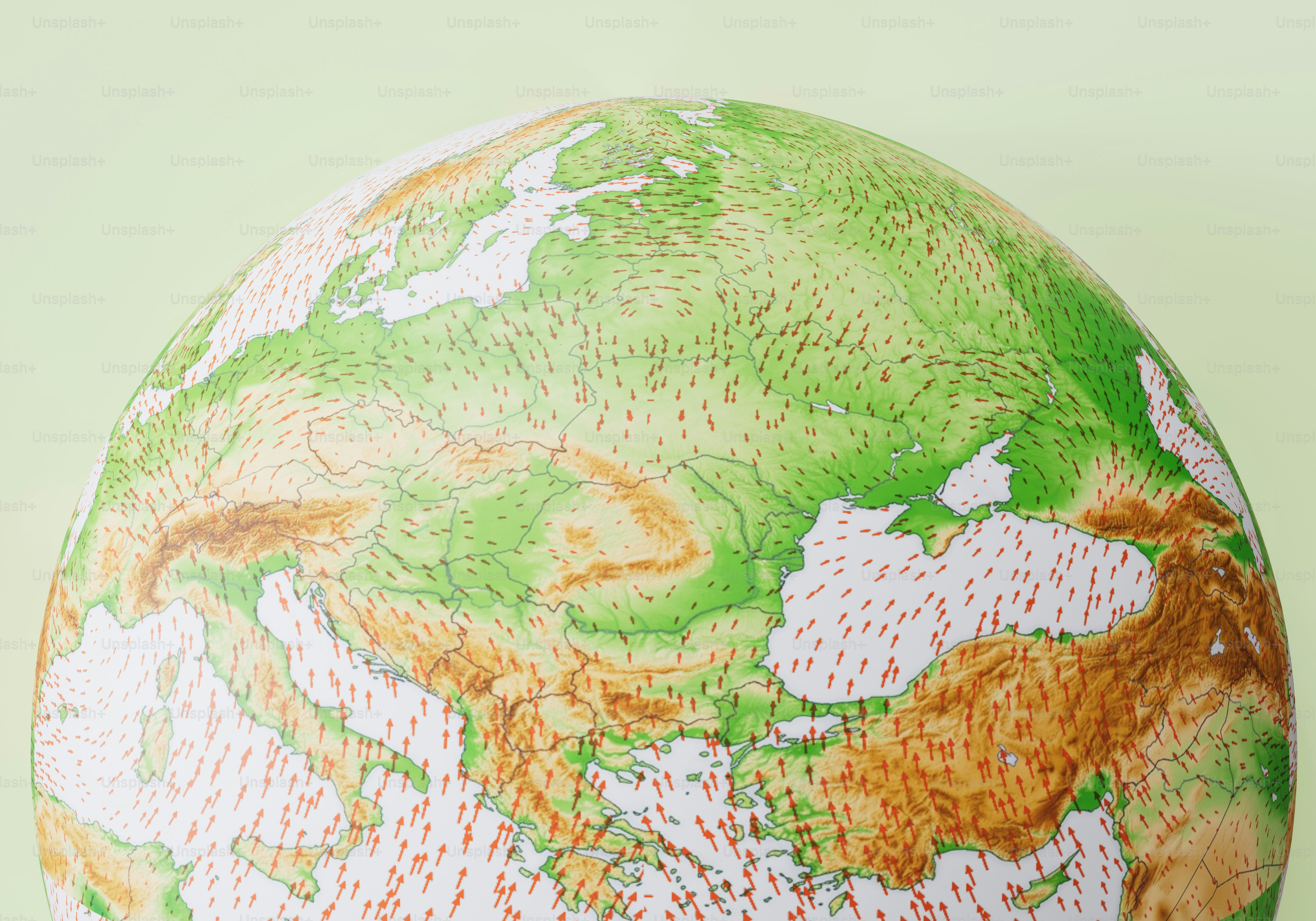 Ein Globus, der Europa und den Nahen Osten zeigt, mit roten Pfeilen, die Windmuster anzeigen