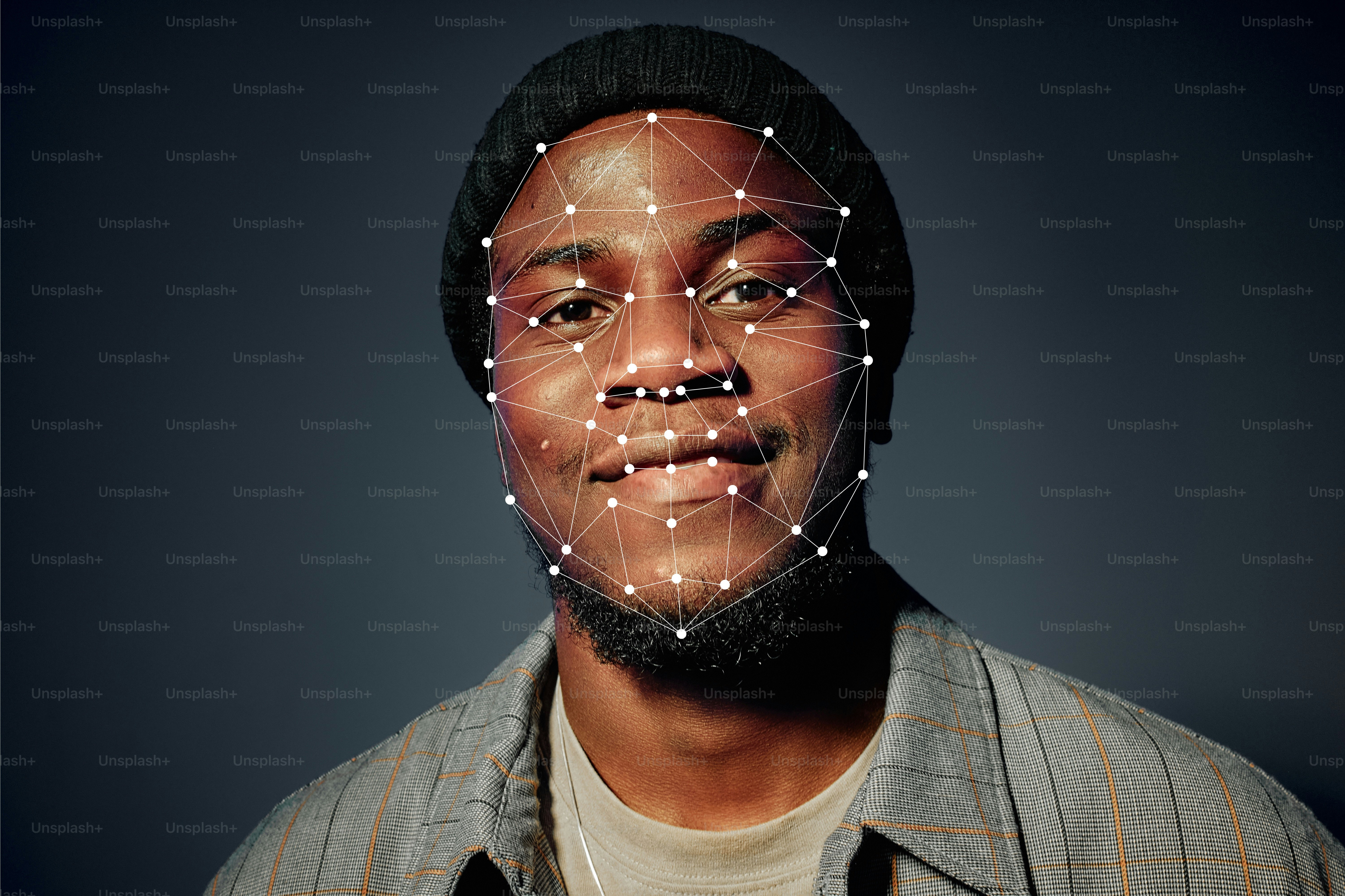 A man wearing a beanie with a digital facial recognition mesh overlay
