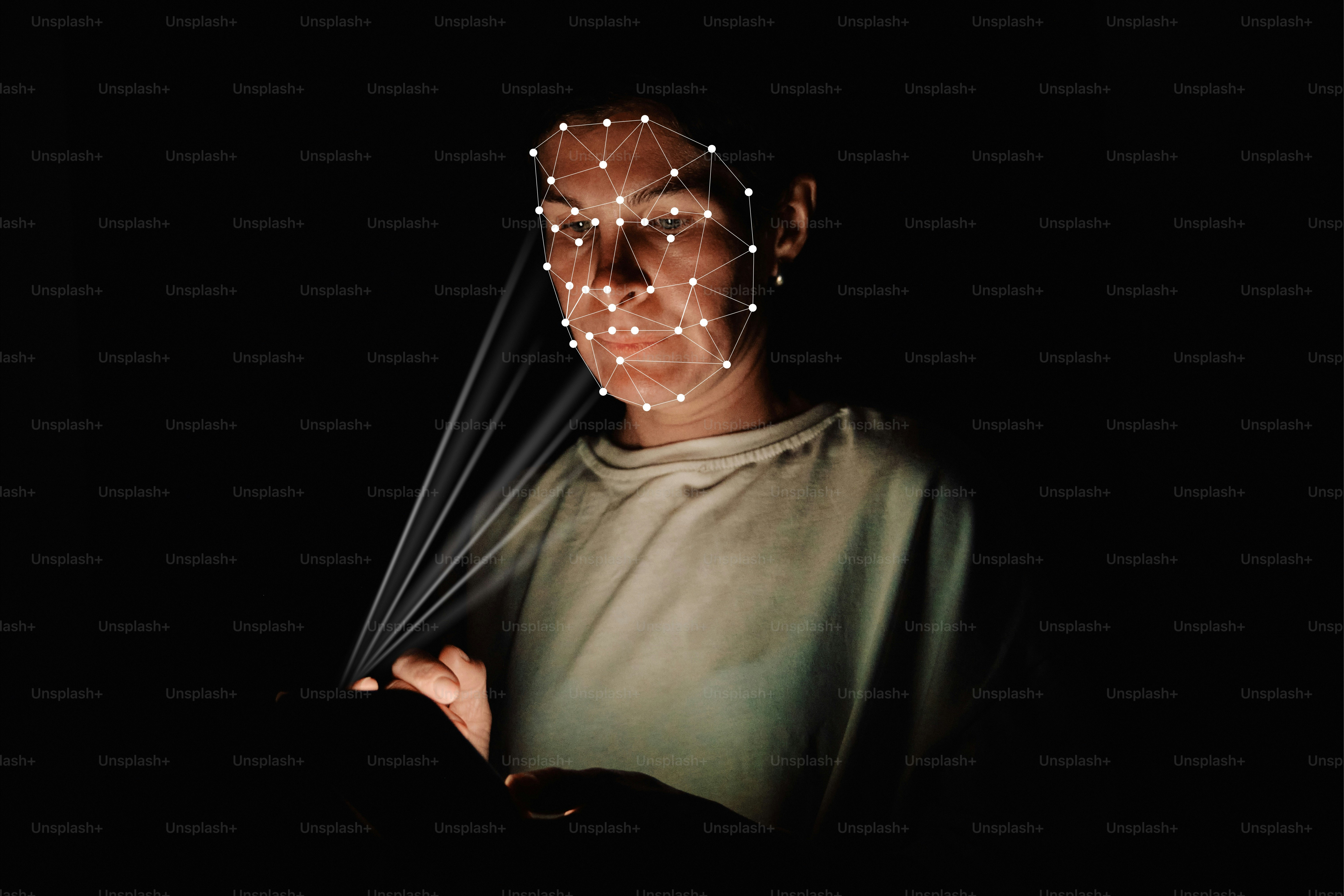 A person with a digital facial recognition mesh projected onto their face