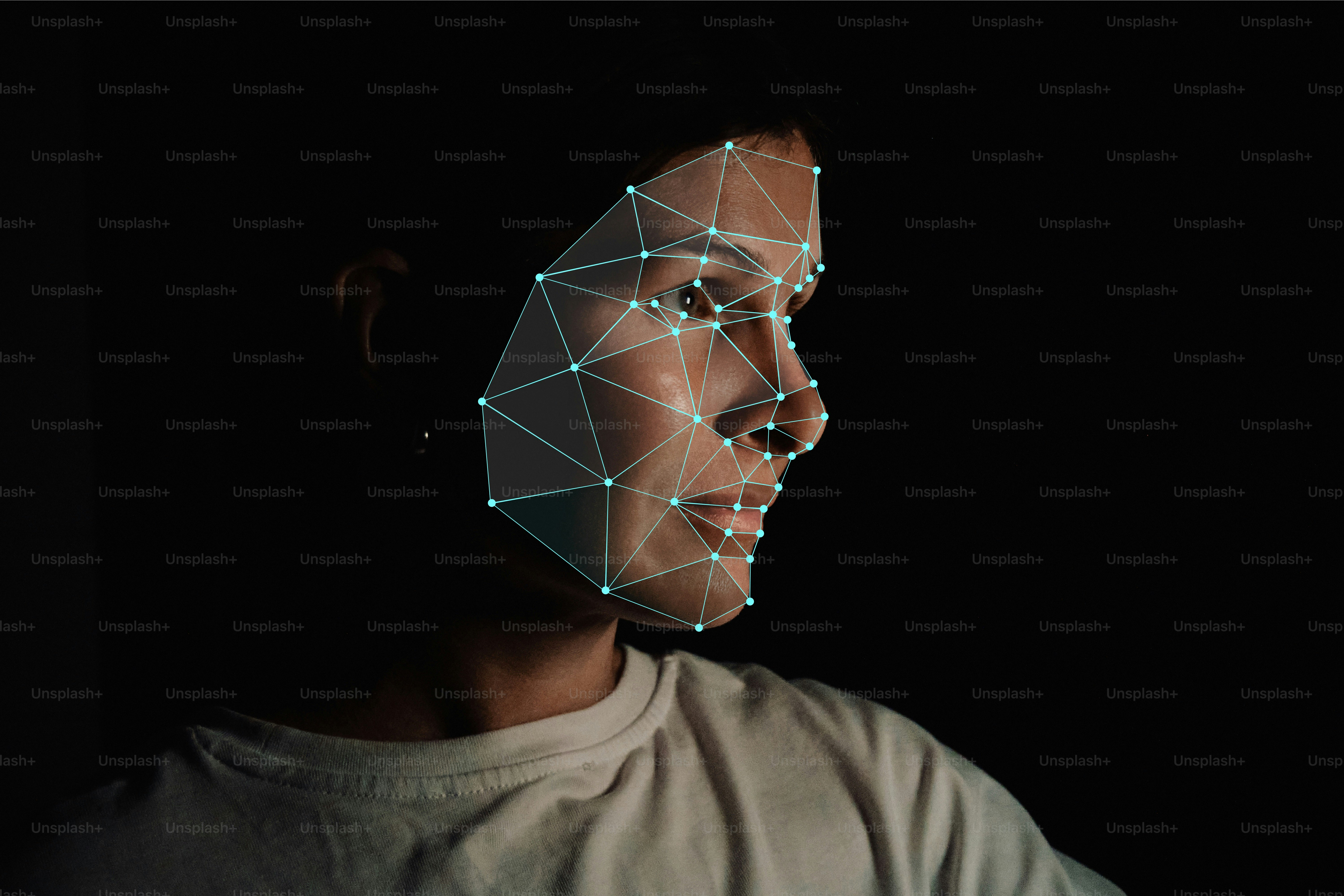 A person with a digital facial recognition mesh overlay on their face