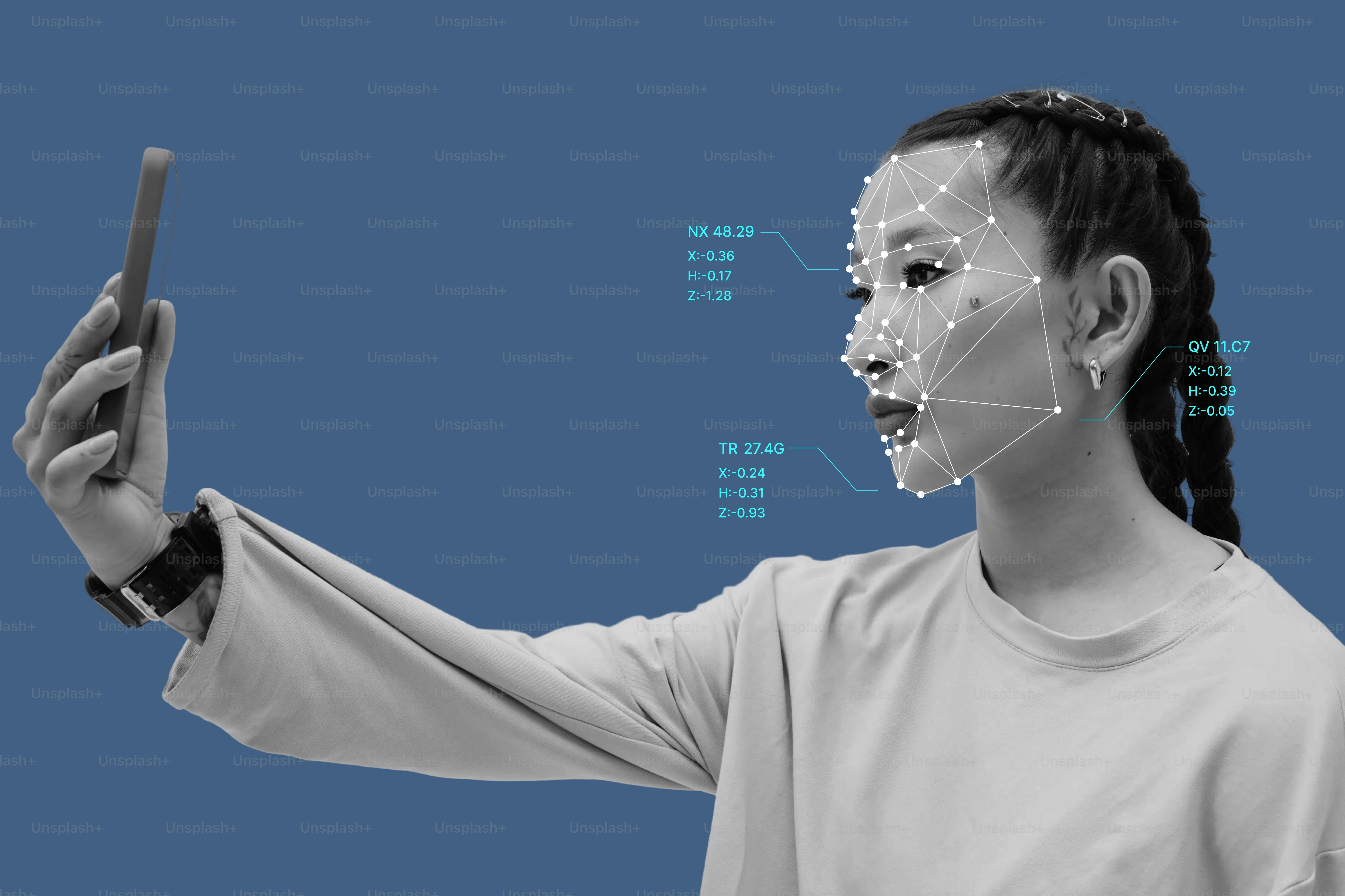 A person holding a smartphone with a digital facial recognition mesh overlay