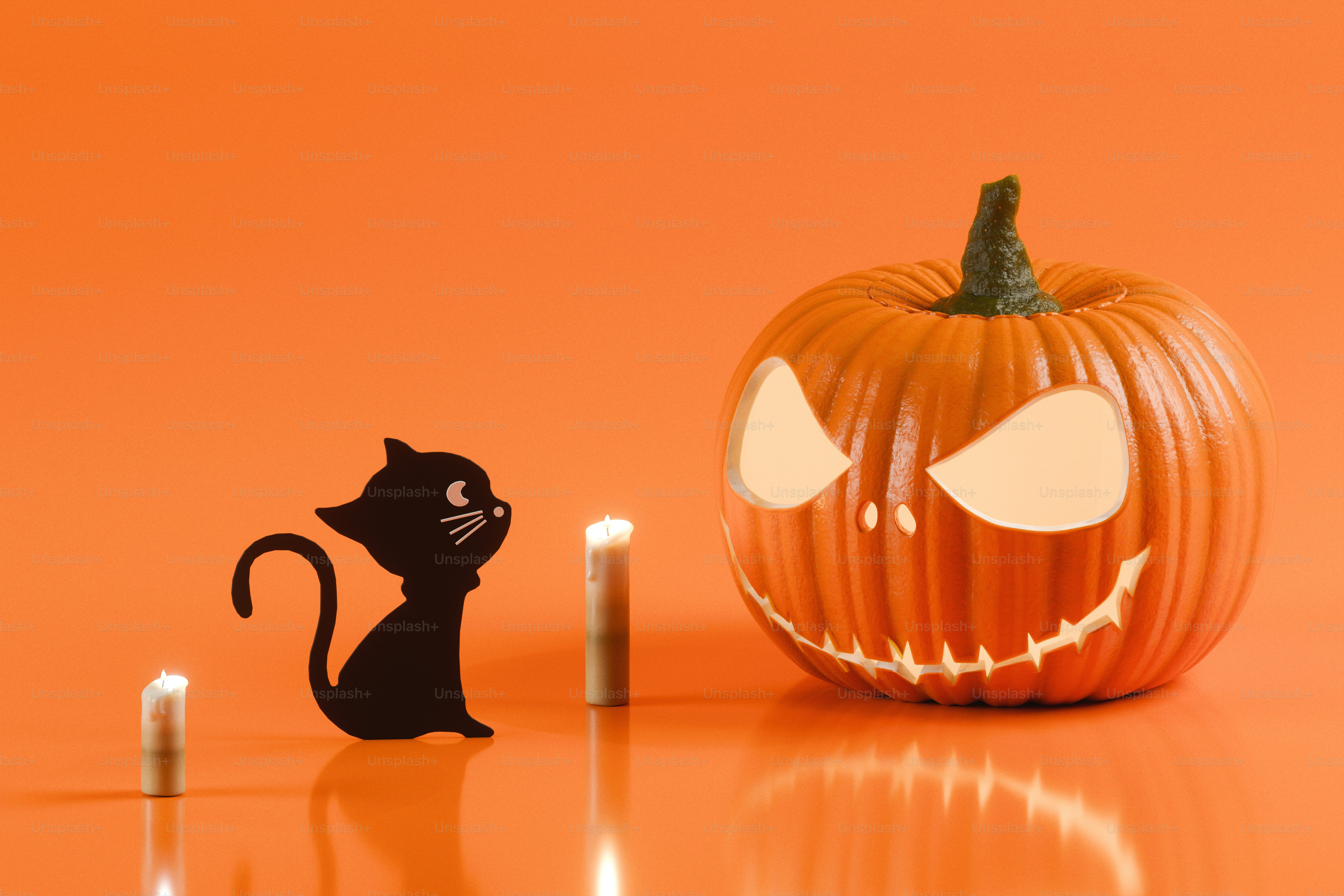A carved jack-o'-lantern, a black cat silhouette, and two candles on orange