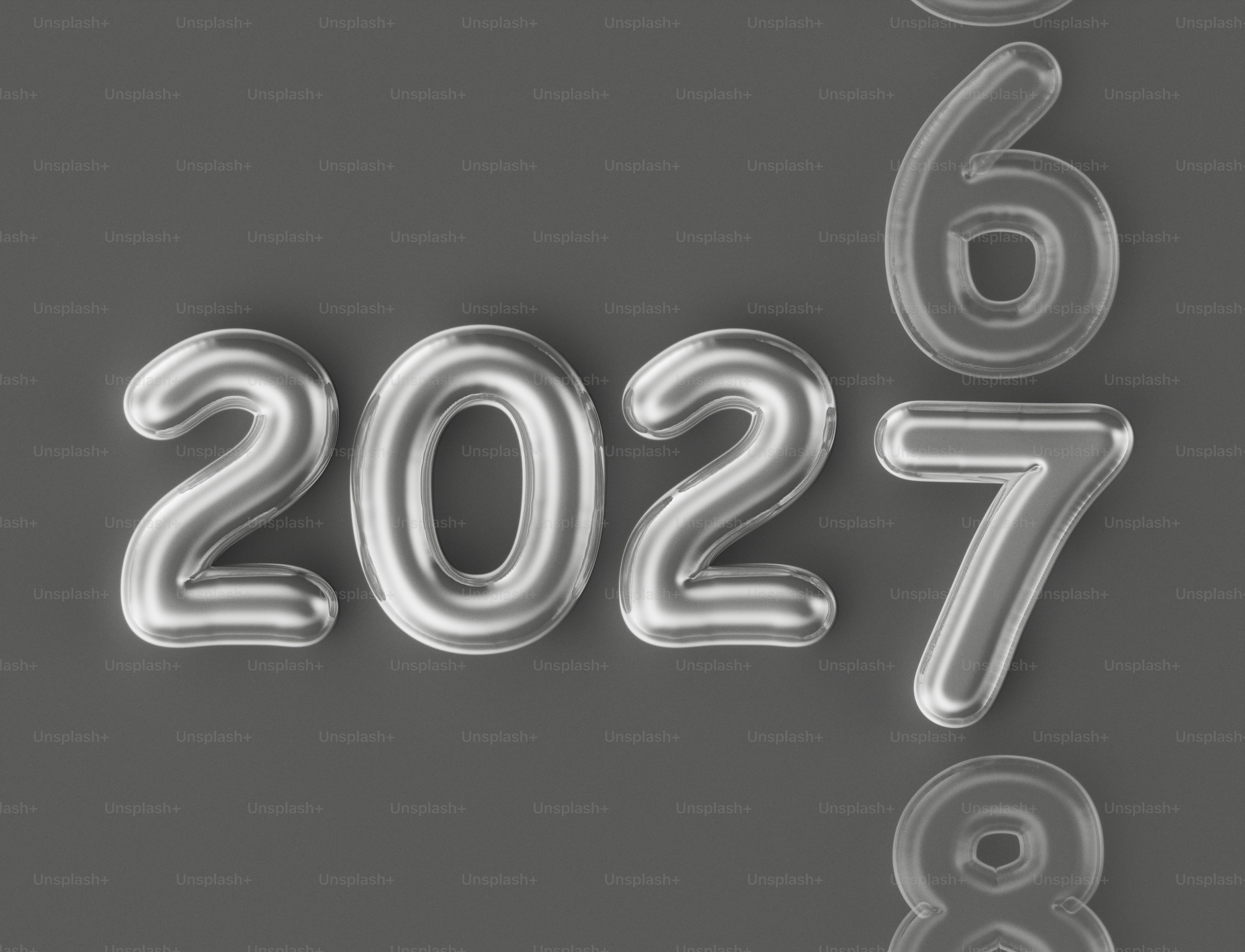 Silver balloon numbers 2027 with a 6 above and an 8 below