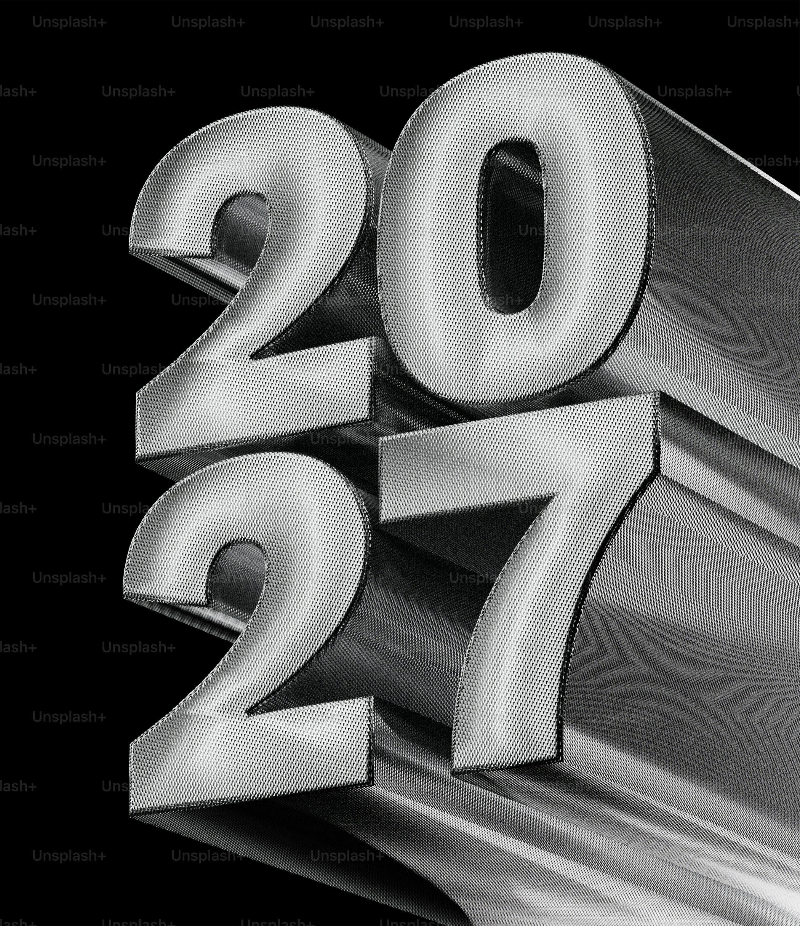 The numbers 2027 in a metallic textured font against a black background