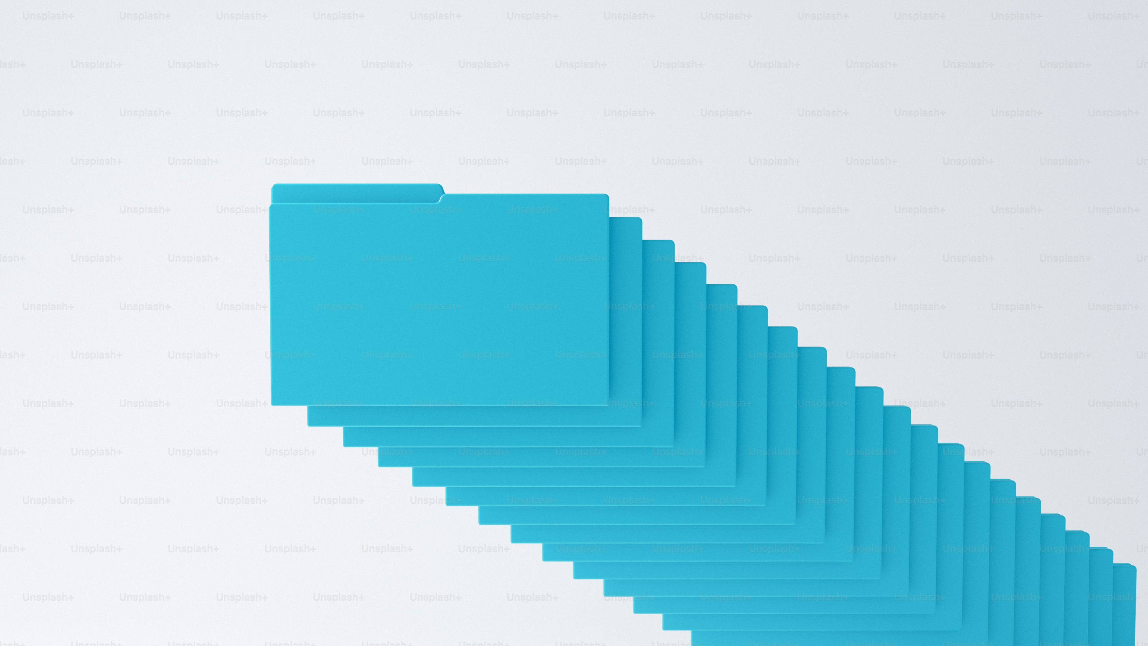A stack of bright blue file folders arranged in a diagonal row