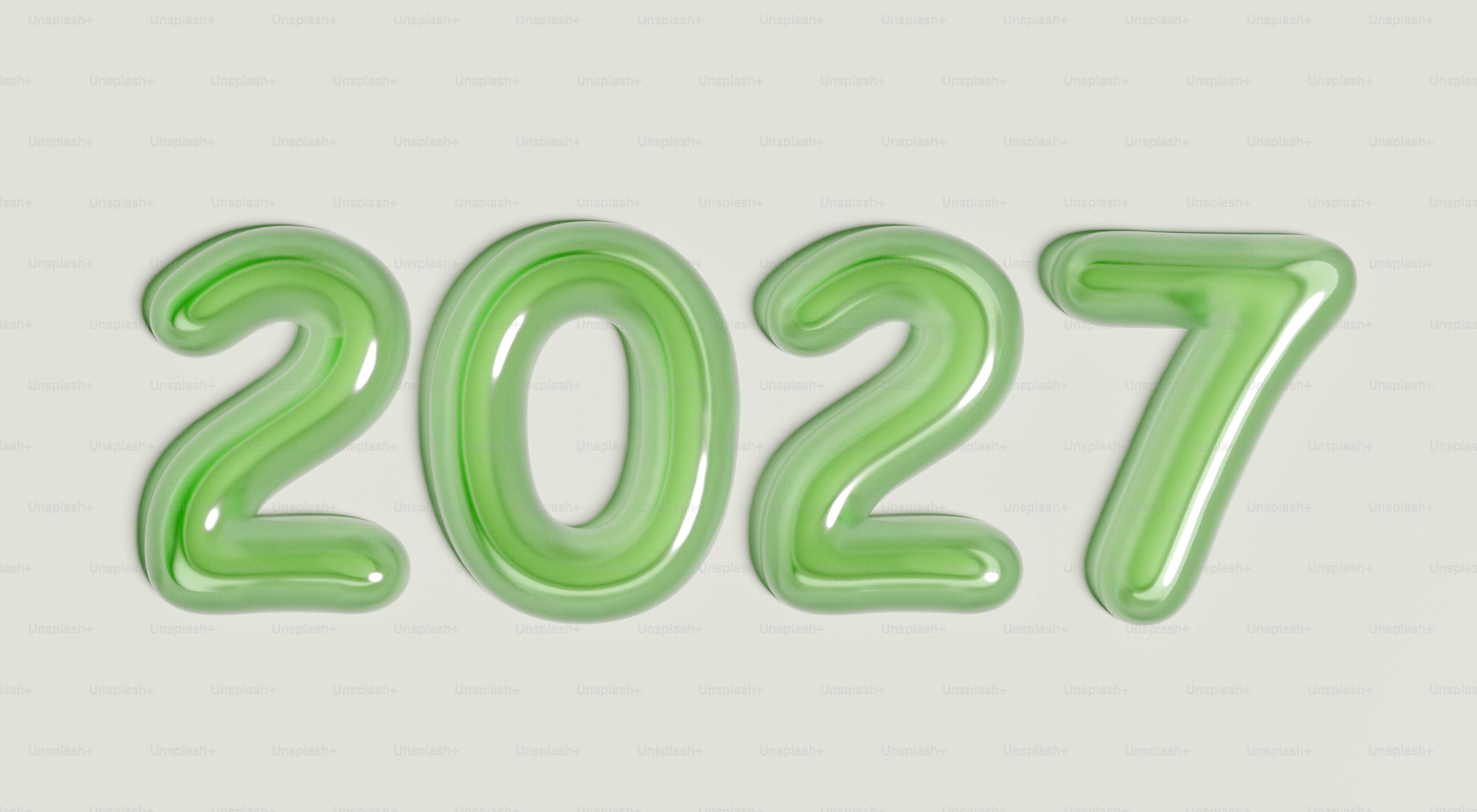 The number 2027 in glossy light green balloon-style lettering on a white background