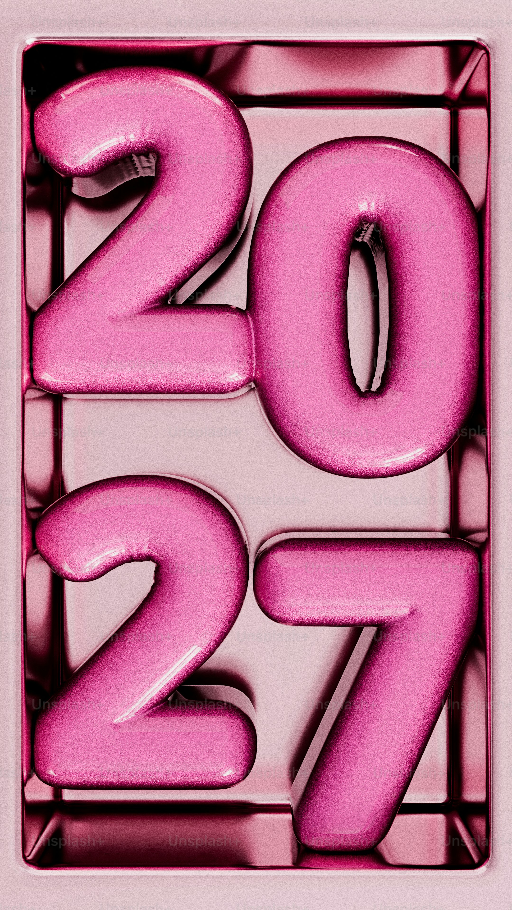 The numbers 2027 in shiny pink metallic font inside a rectangular frame