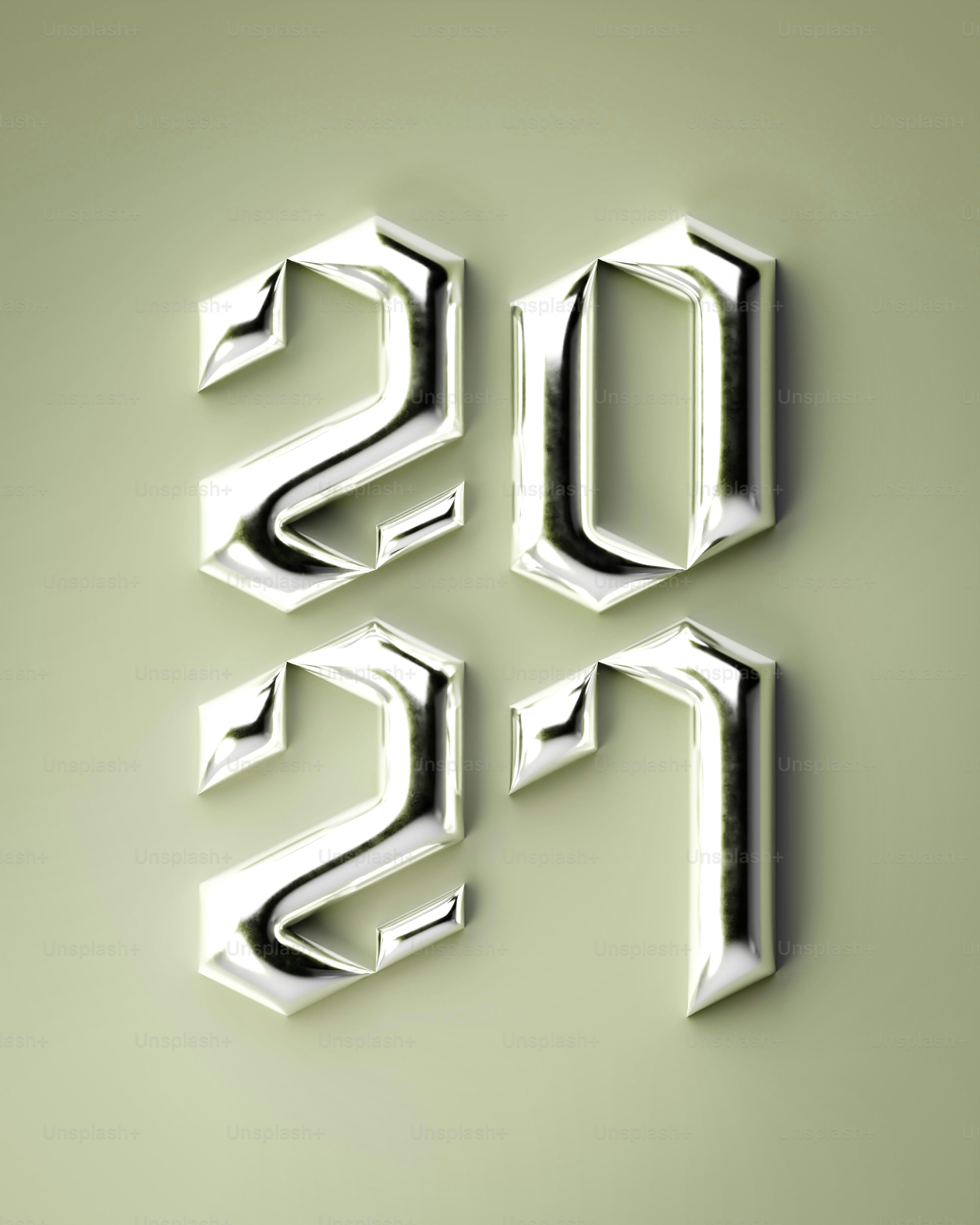 The numbers 2021 in a metallic chrome font on a light green background