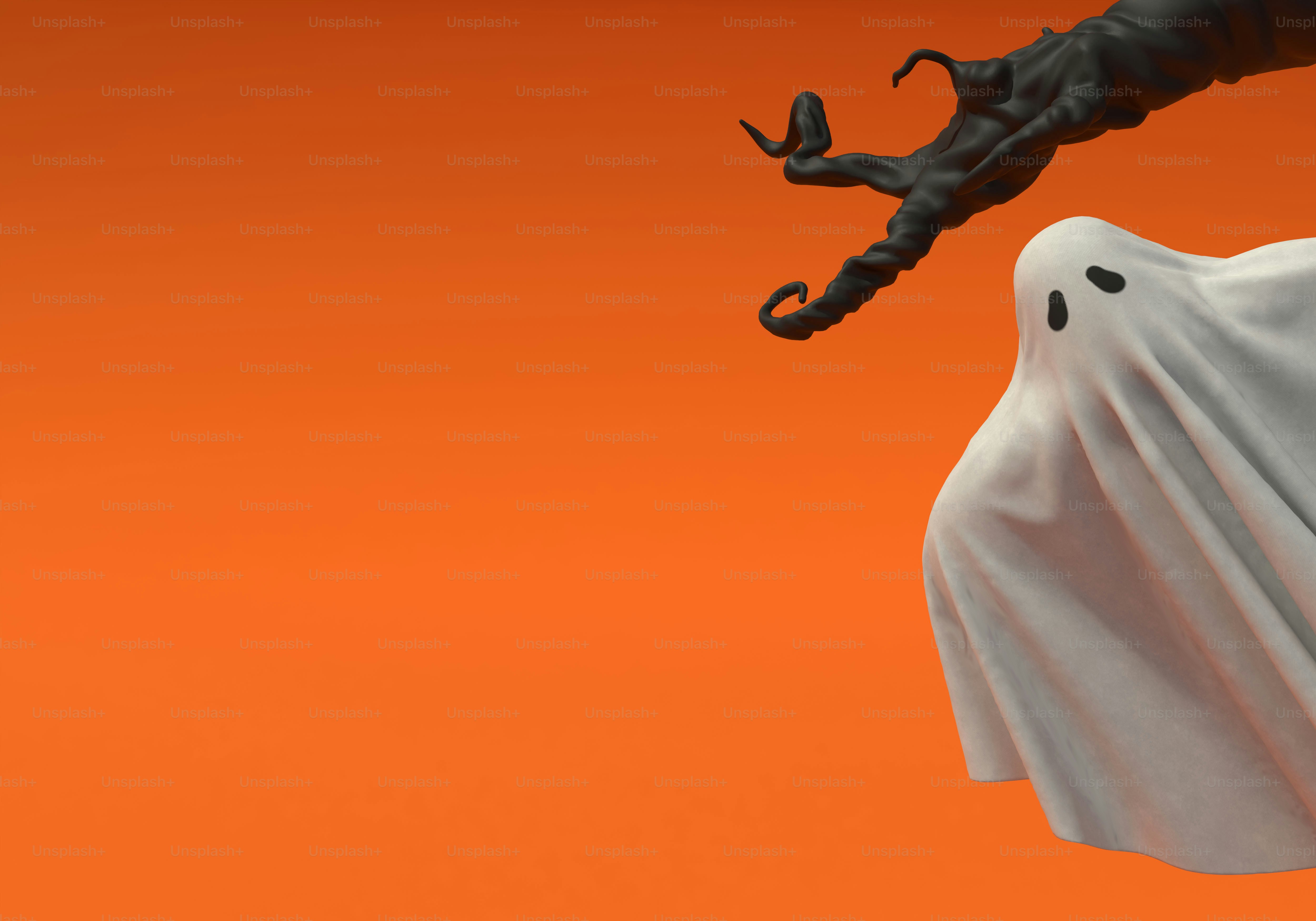 A white ghost sheet and a black twisted branch against an orange background