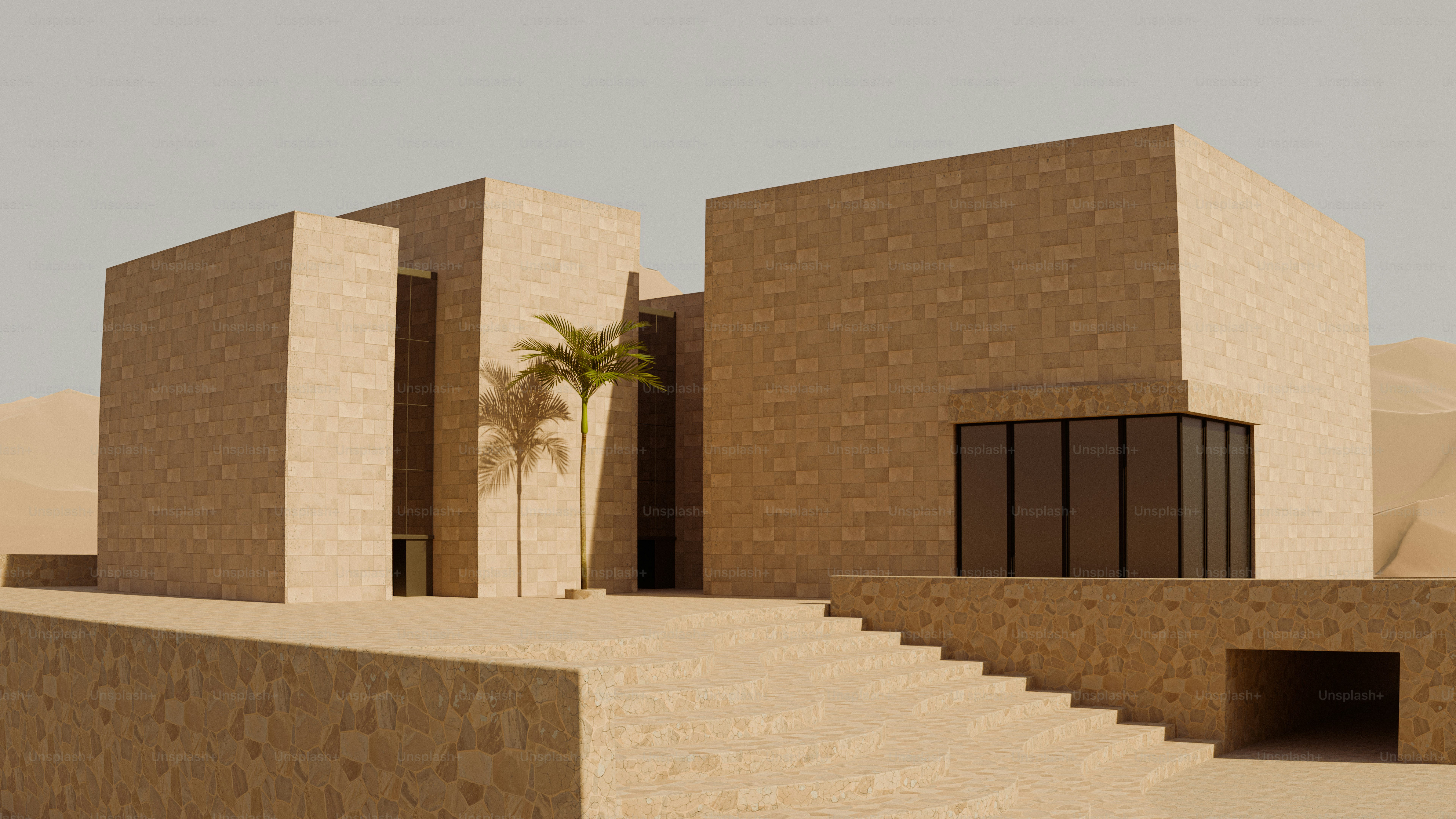 Modern stone building with a palm tree in a desert landscape