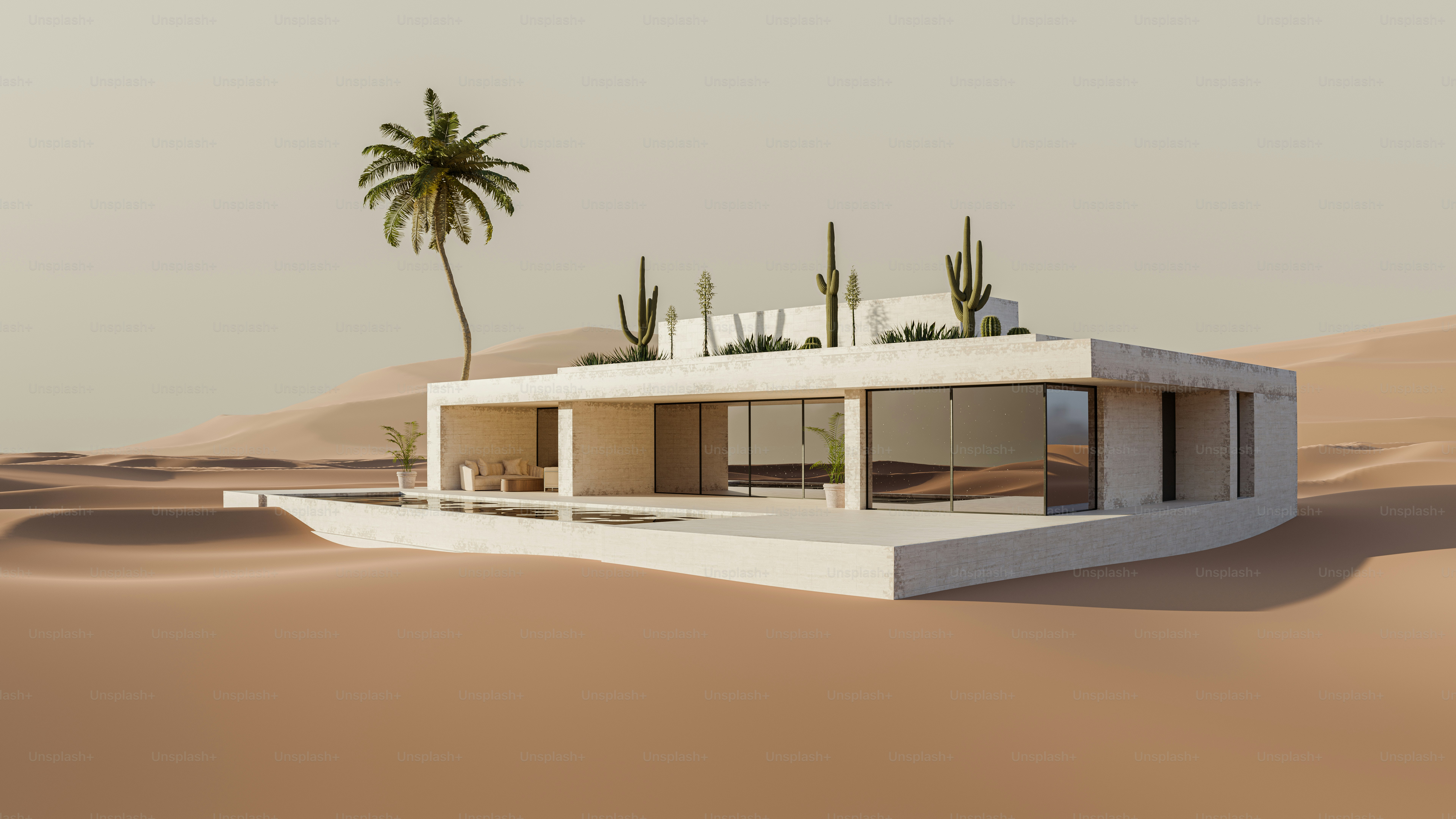 A modern white villa with a pool surrounded by sand dunes and cacti