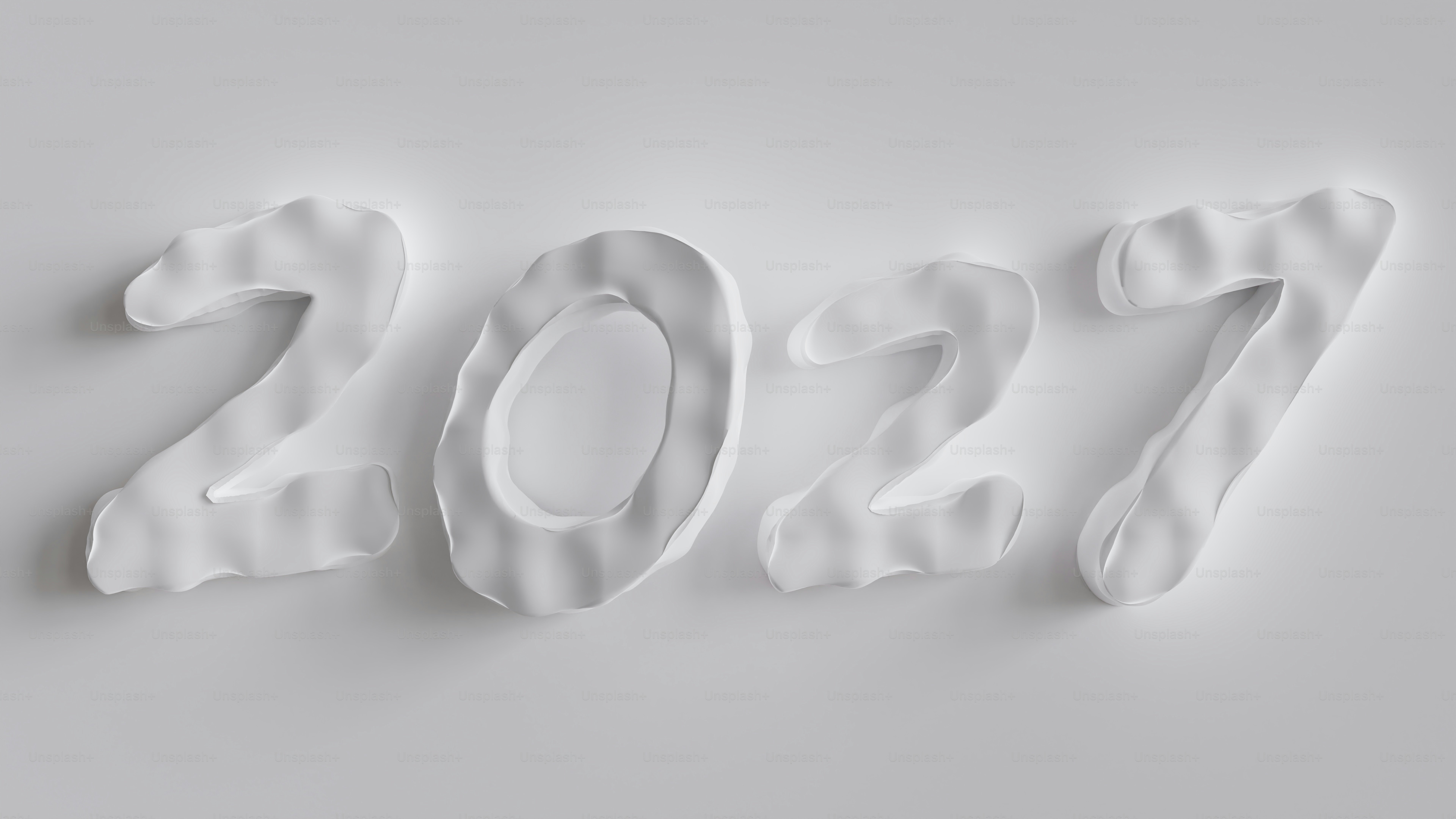 연한 회색 배경에 부드러운 그림자가 있는 흰색 숫자 2027