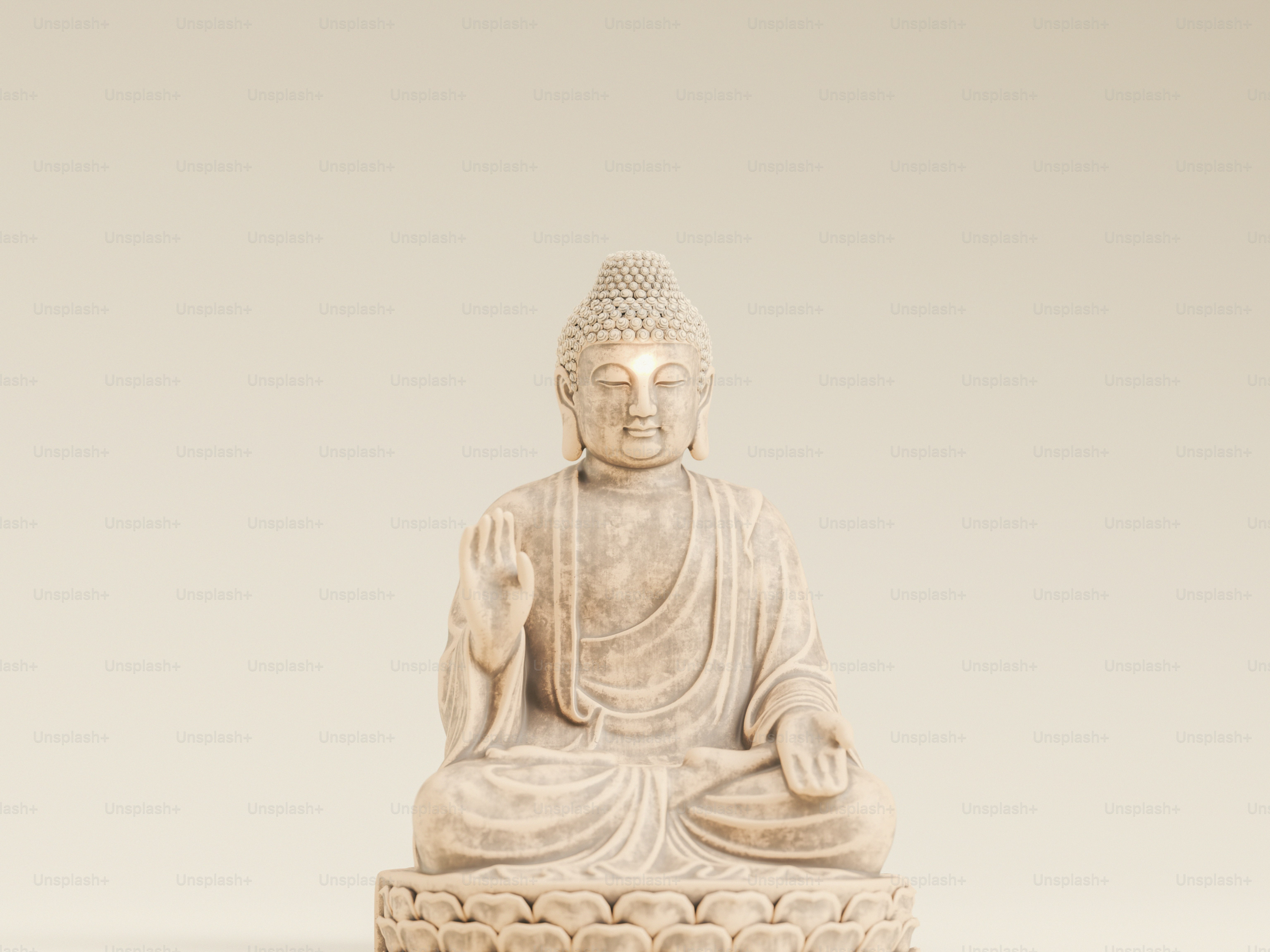 A stone Buddha statue in a meditative pose on a lotus base