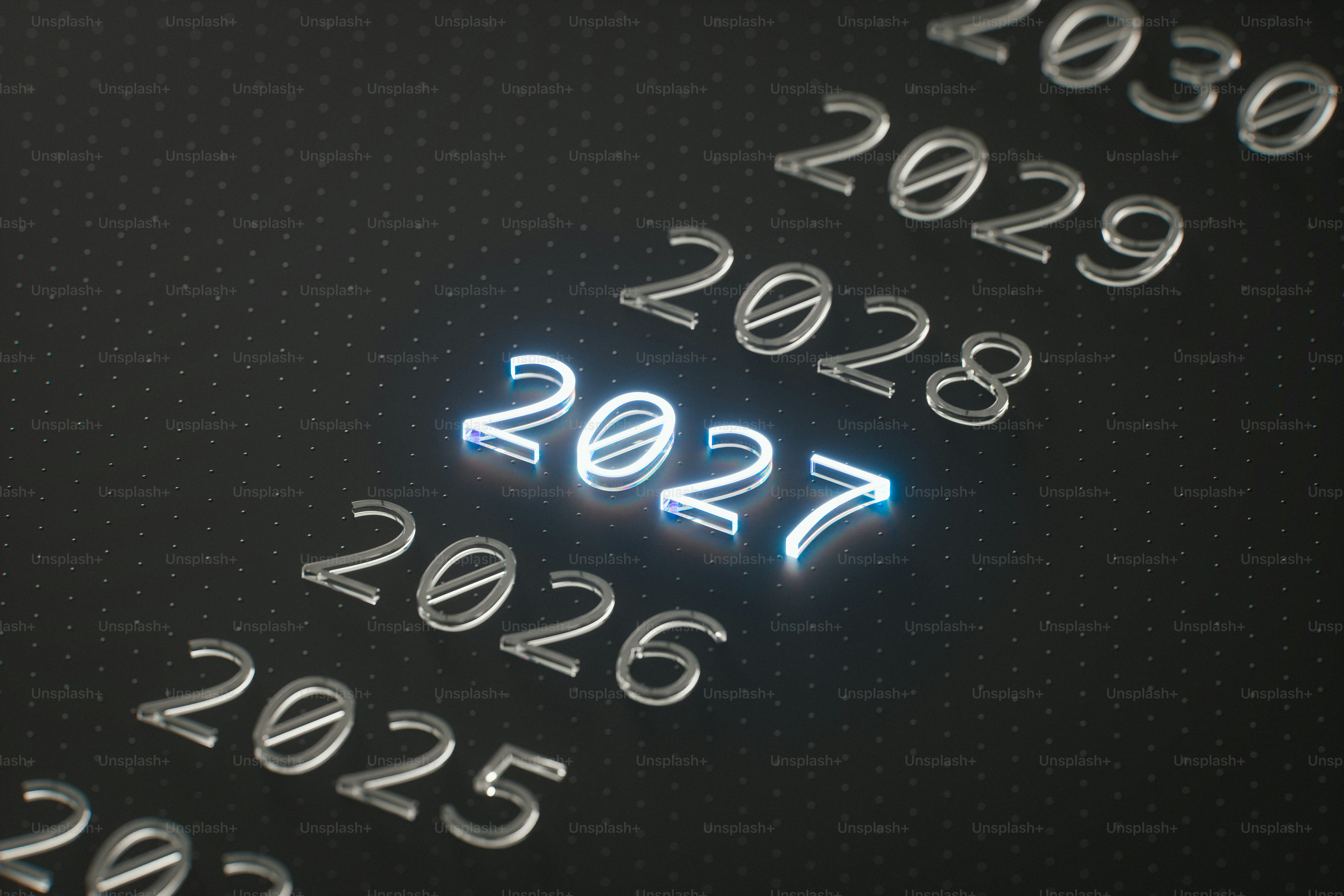 The year 2027 glowing in bright blue light among other years on a dark surface