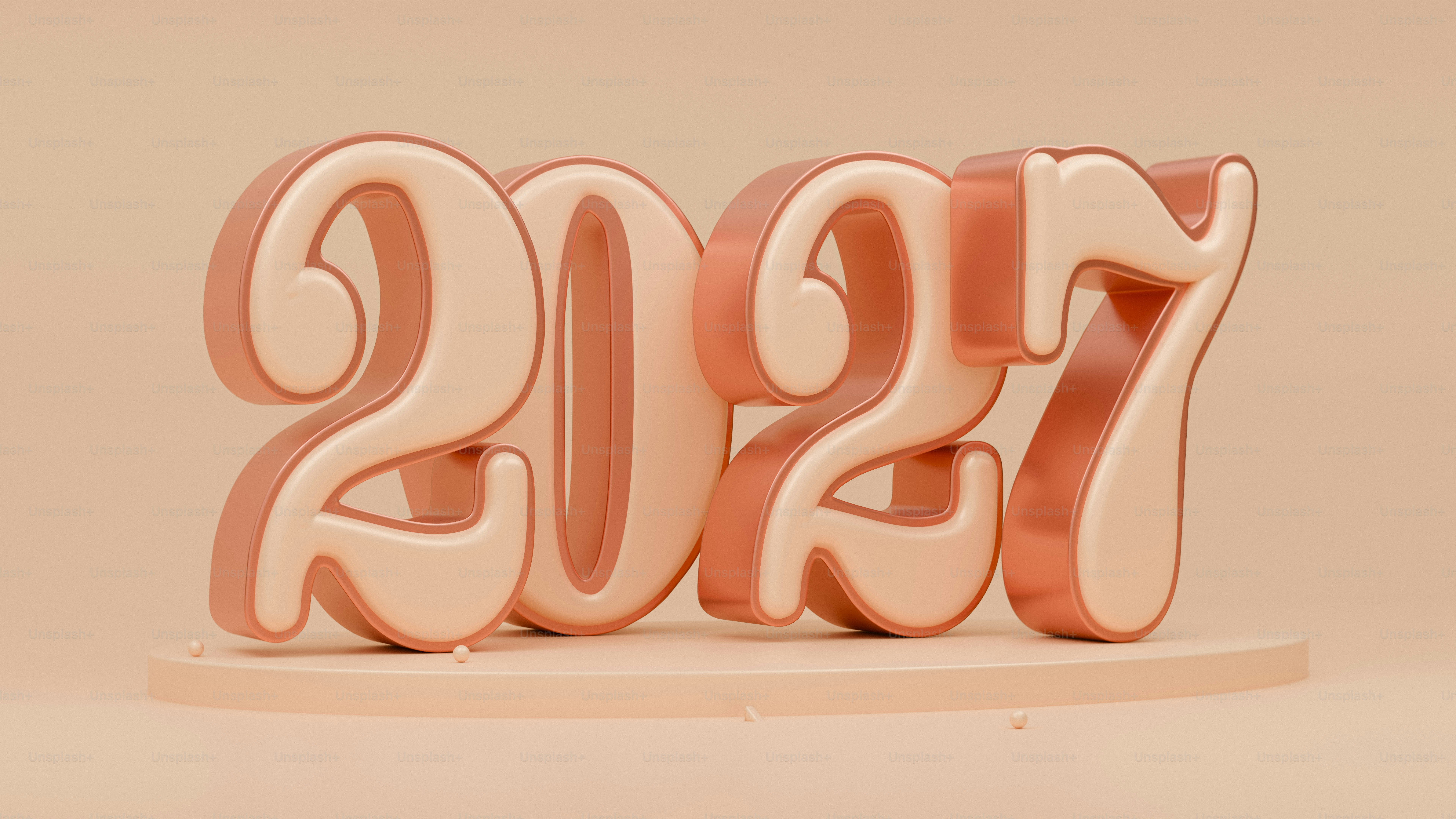 Three-dimensional numbers 2027 in a soft peach color on a circular platform