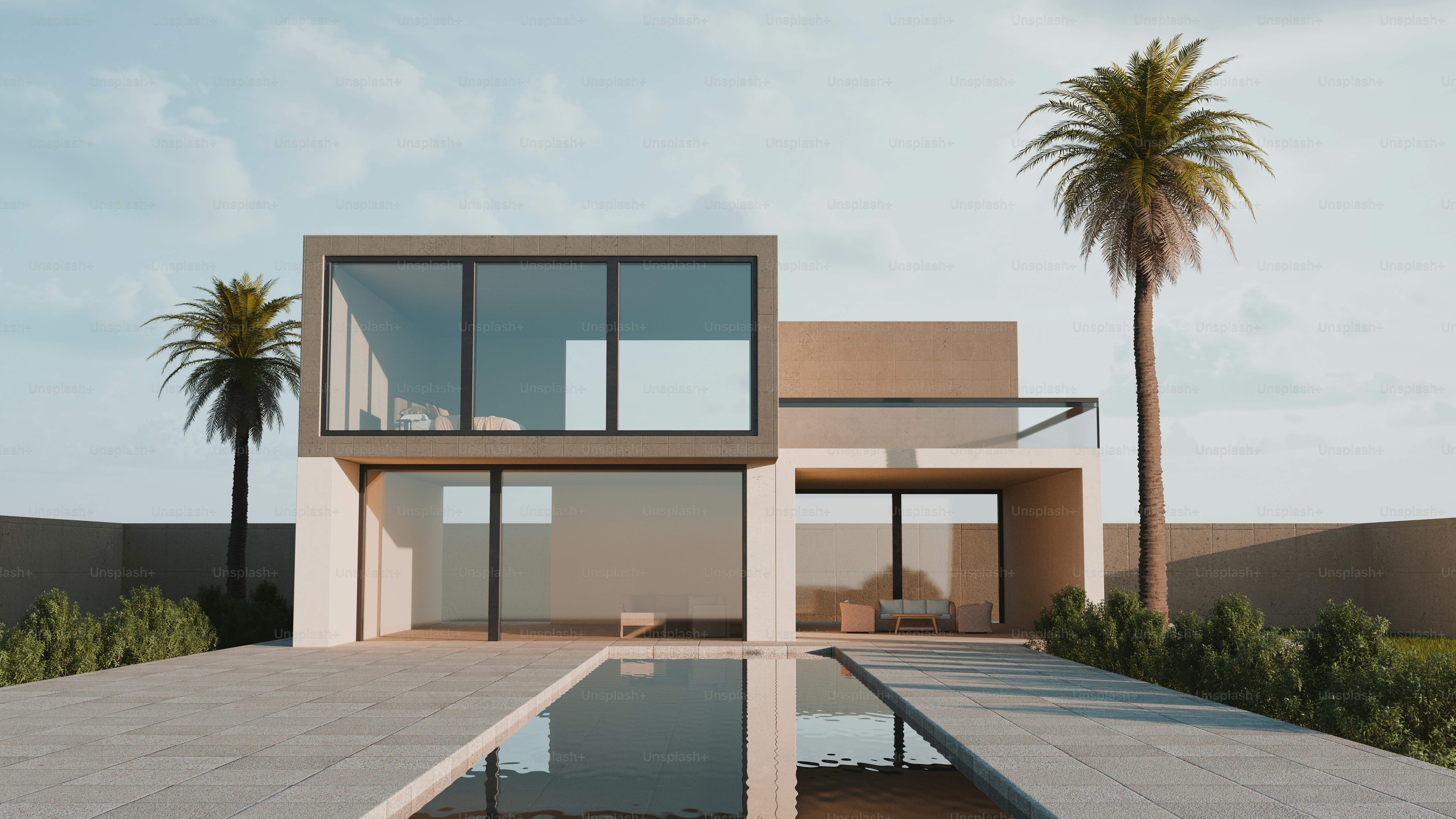 Une villa moderne à deux étages avec de grandes fenêtres vitrées et une piscine