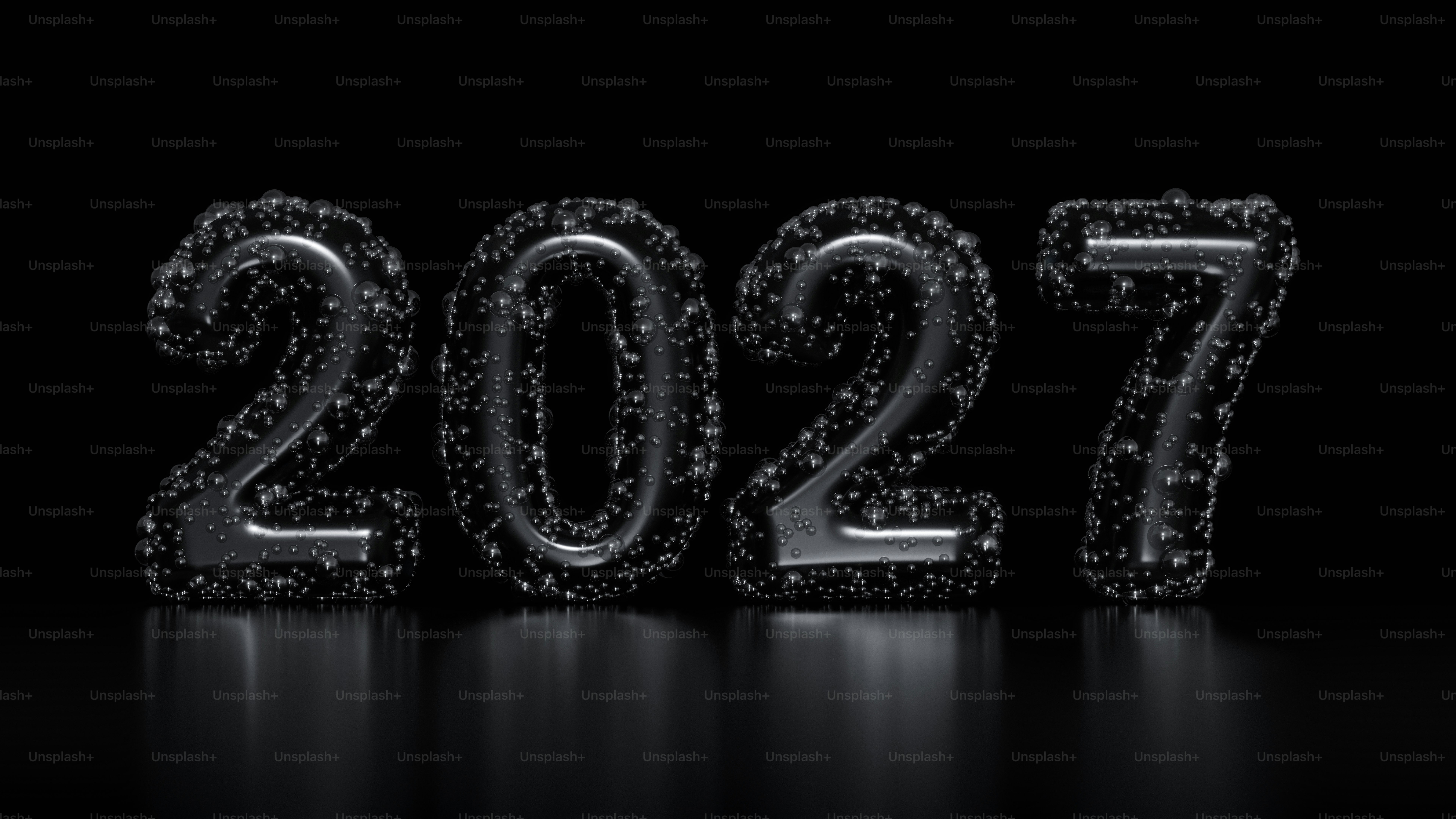 The number 2027 formed by dark metallic digits covered in small water droplets
