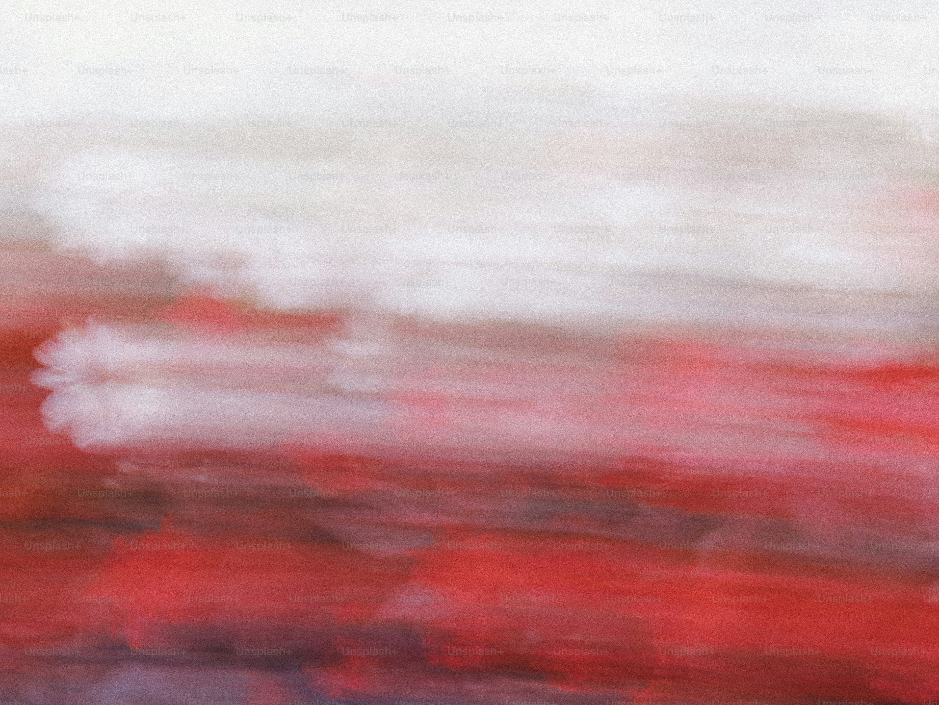 A soft abstract gradient shifting from white to deep red