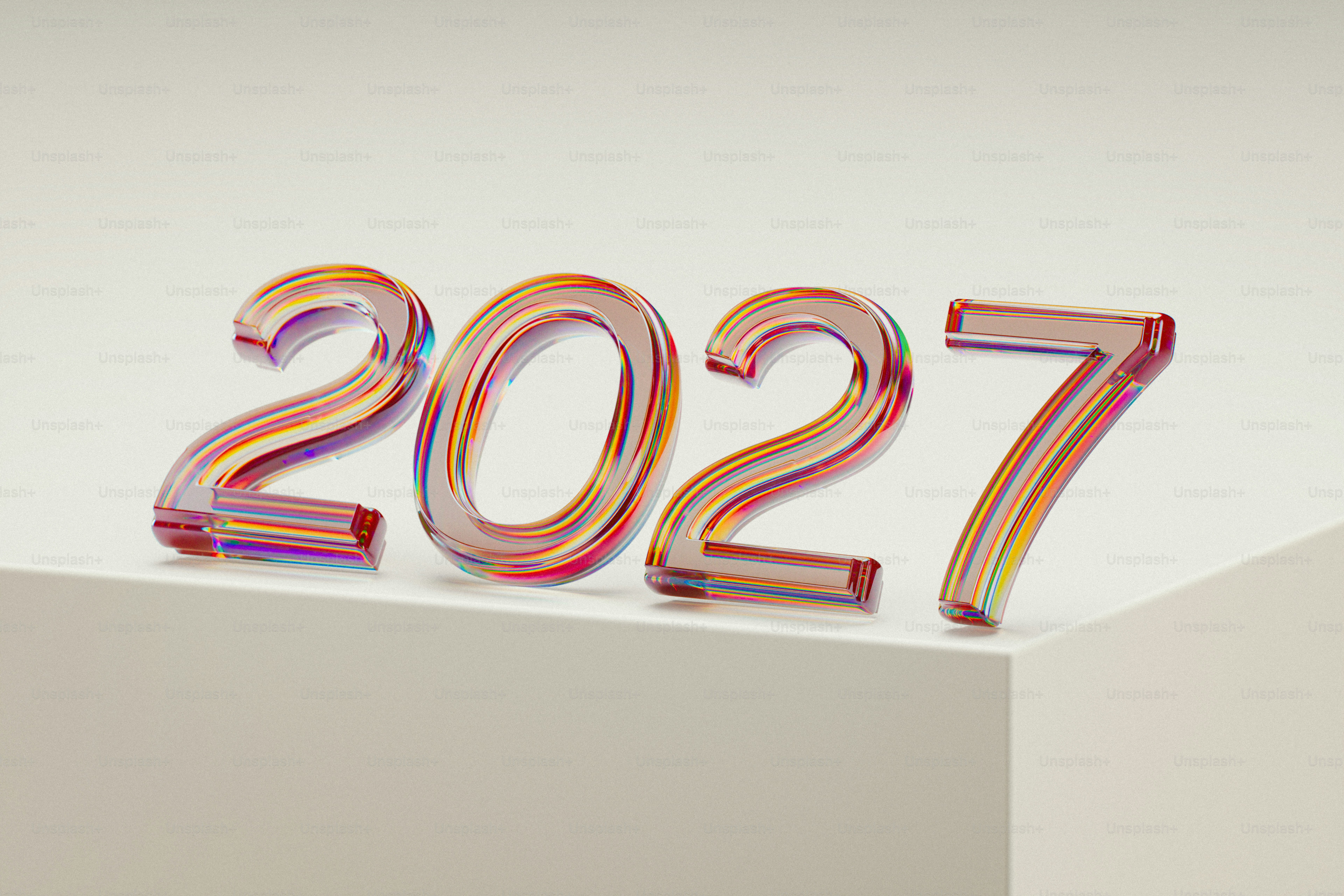 The number 2027 in iridescent glass digits on a white surface