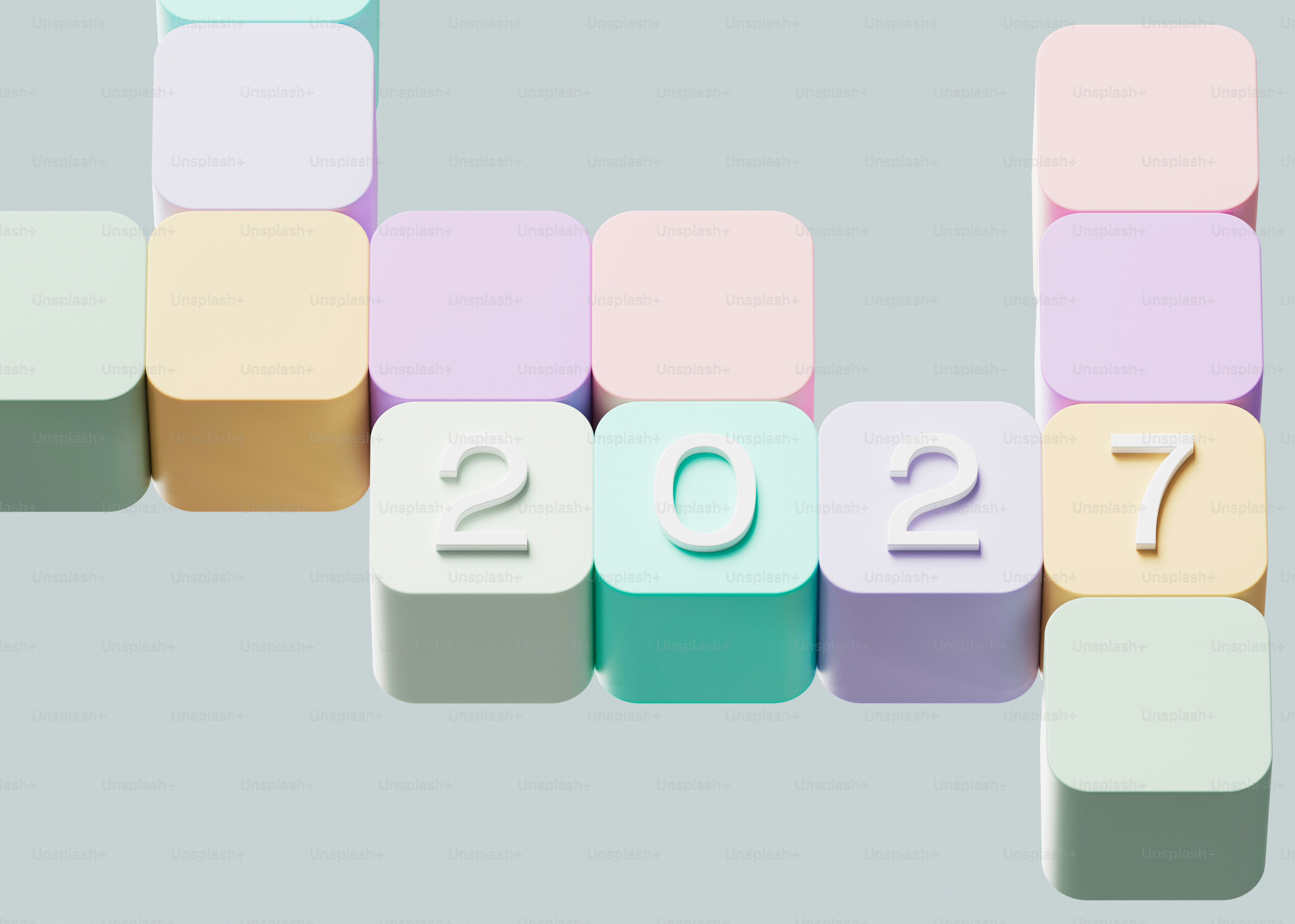 Pastel colored rounded cubes arranged in a grid with the number 2027