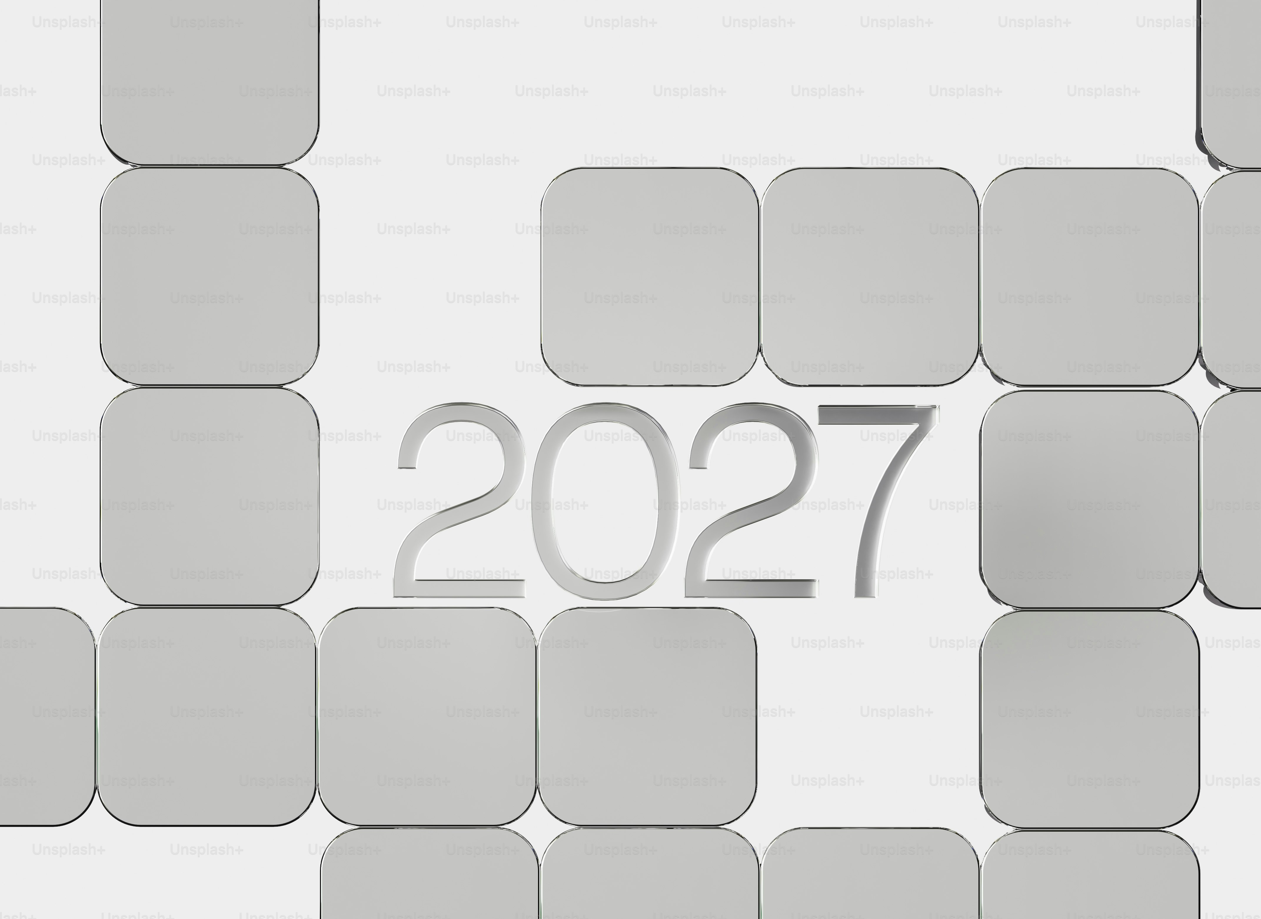 The number 2027 in silver metallic font surrounded by rounded square tiles