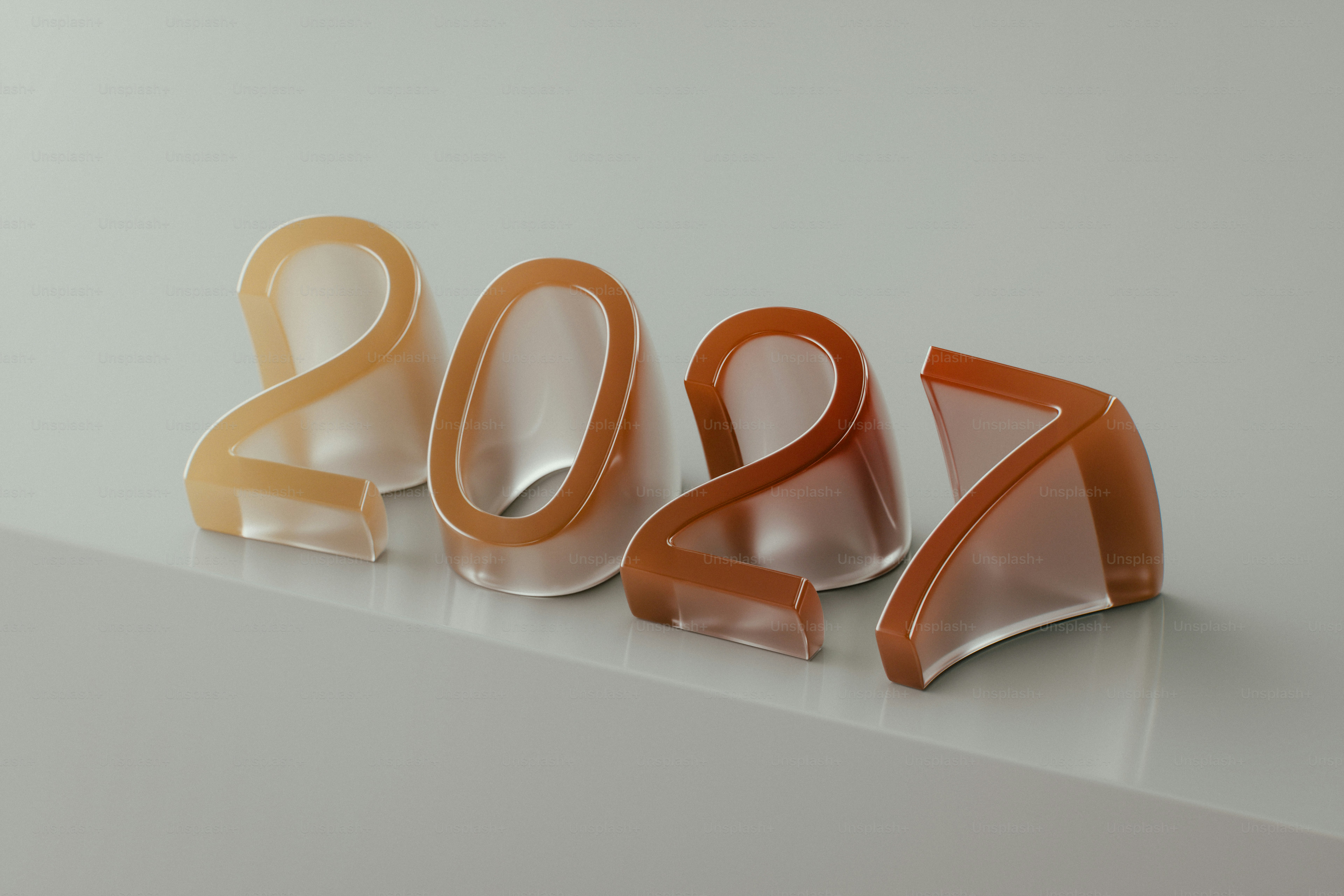 The numbers 2027 in translucent gradient colors on a light grey surface