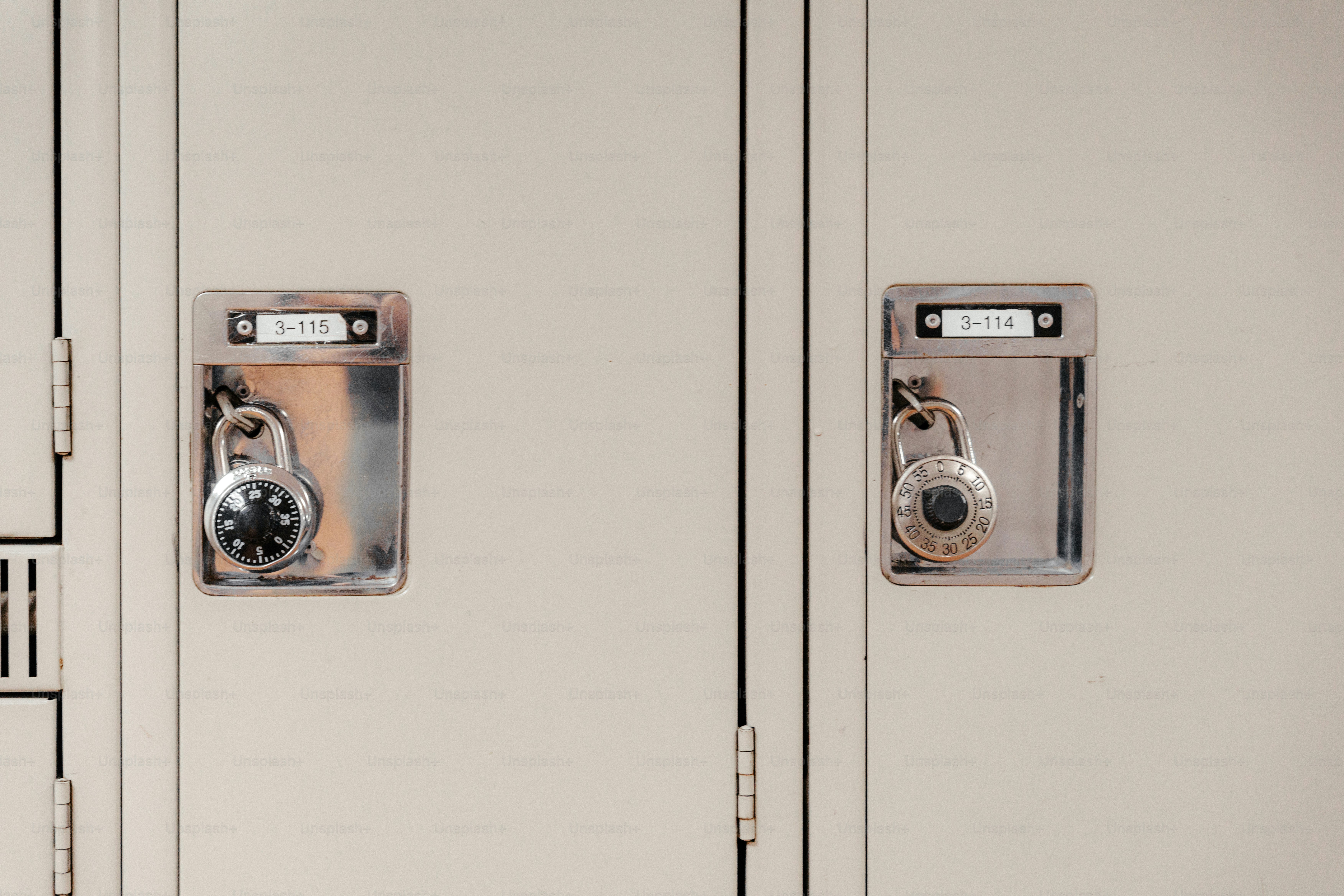 Two beige metal lockers with combination padlocks and numbered identification tags