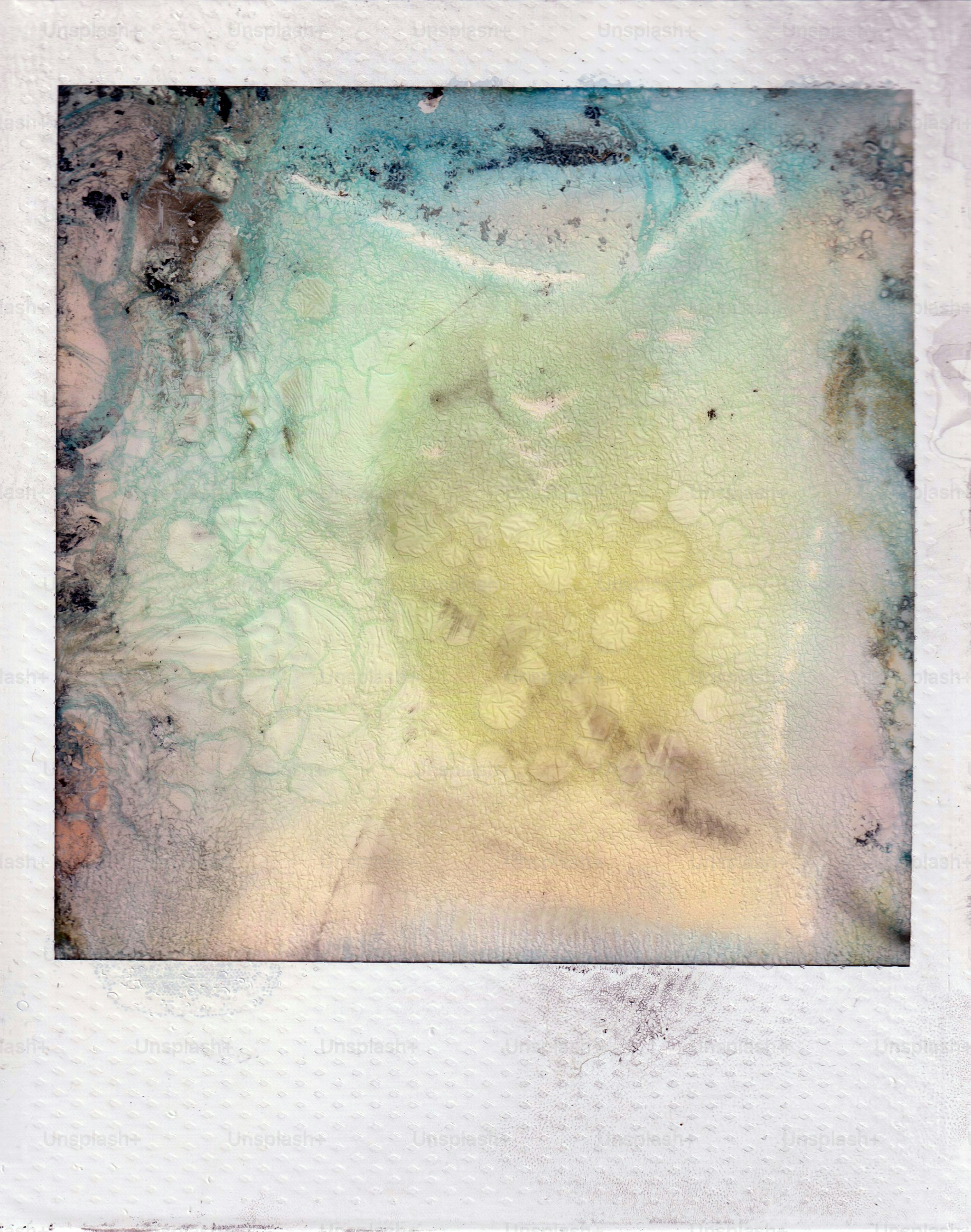 Abstract textured surface with blended shades of yellow, green, and blue