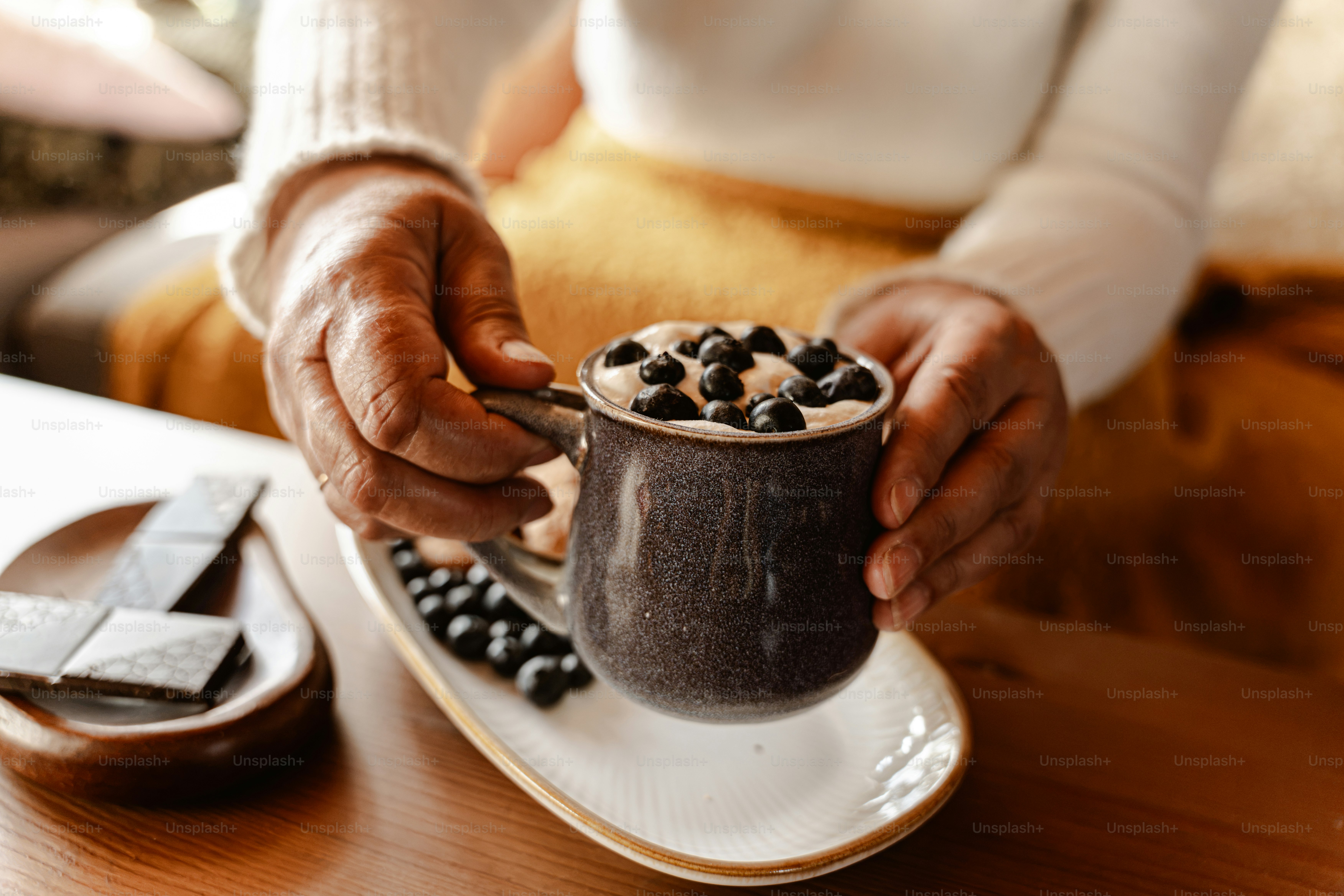 Mug of milk with orange cinnamon - Photo on Unsplash+