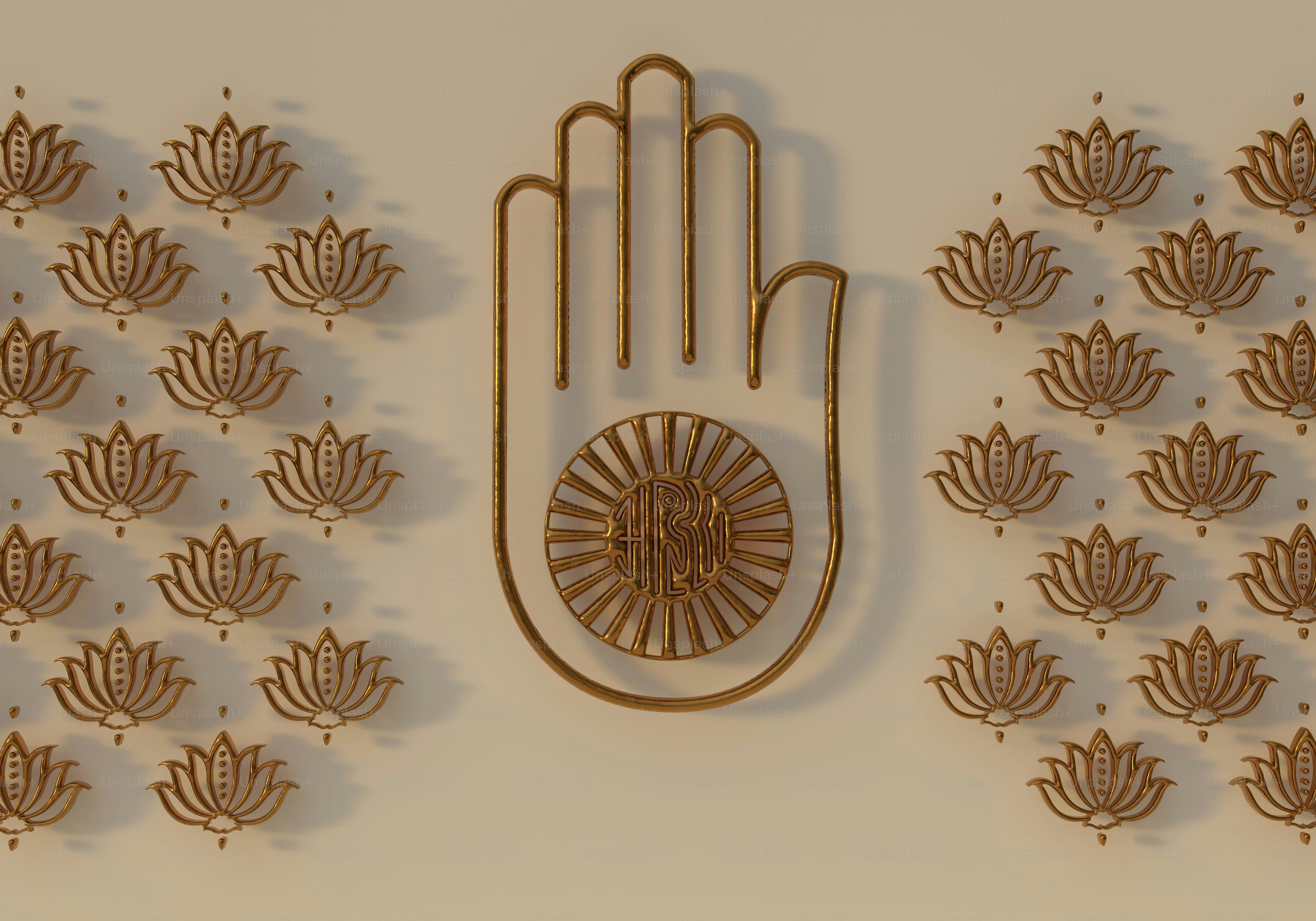 A golden hand symbol with a wheel and lotus patterns on a beige wall