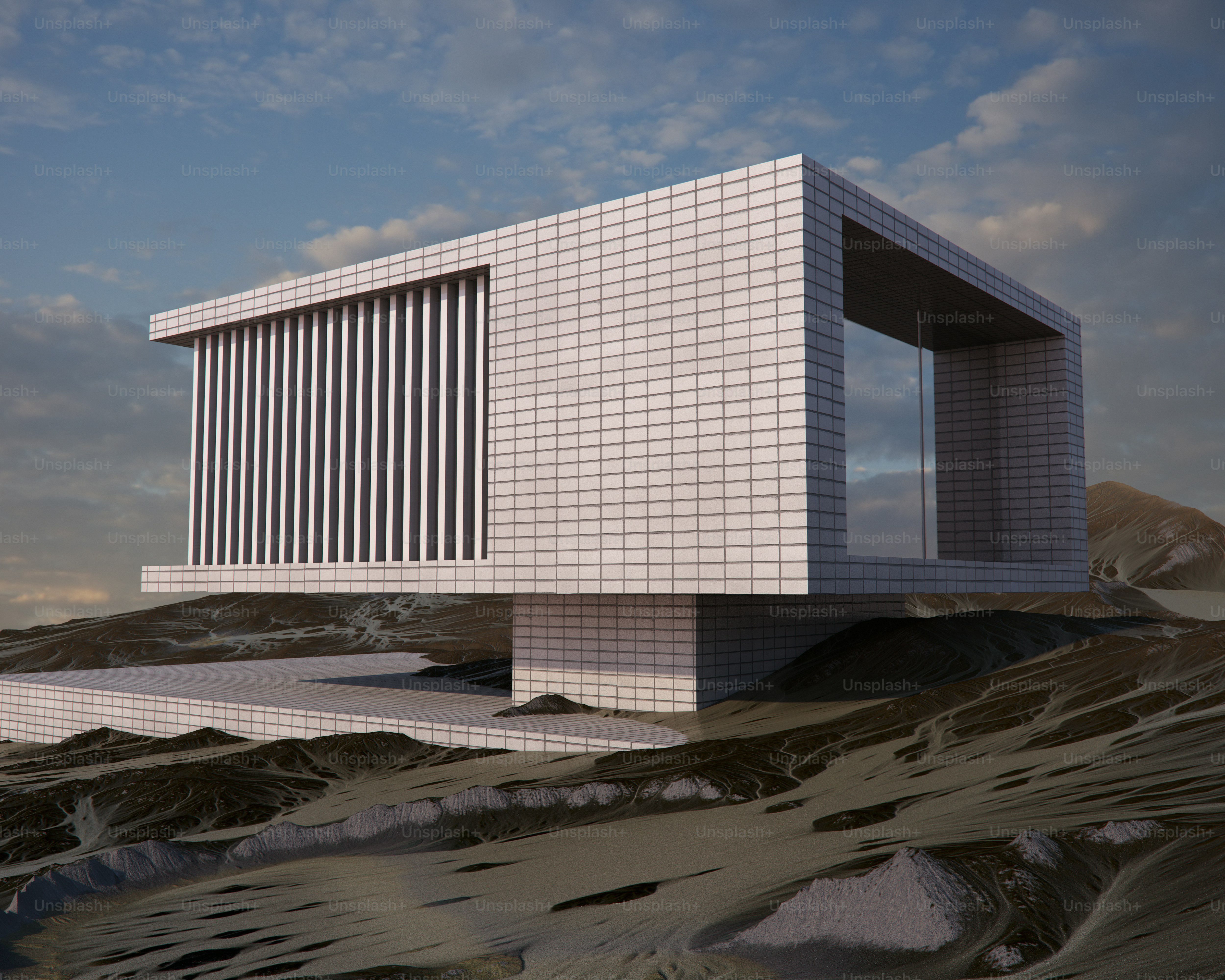 Modern white building on rocky landscape - Photo on Unsplash+
