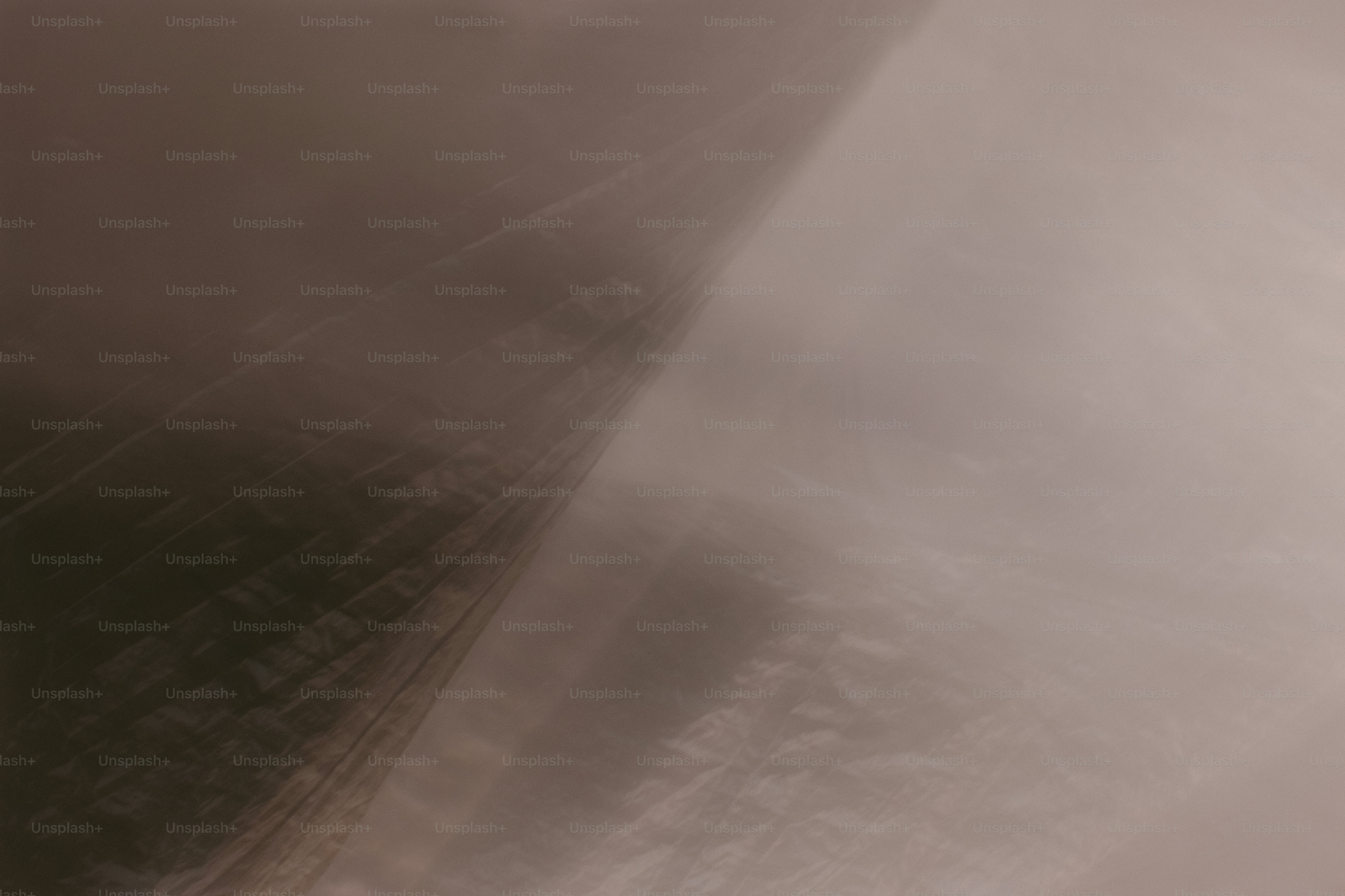 A soft gradient shifting from dark brown to a pale beige light