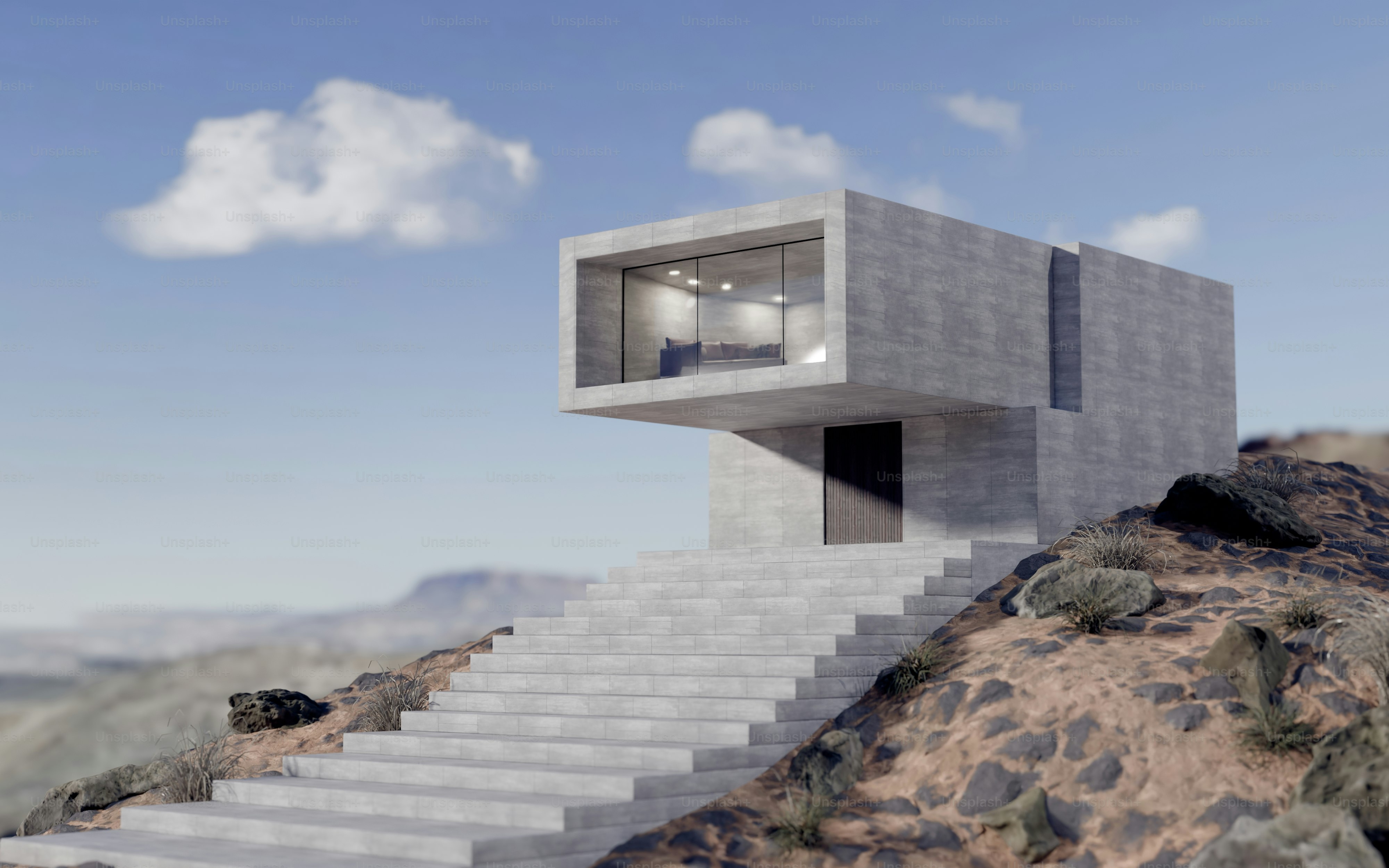 Uma casa moderna de concreto com uma parede de vidro em uma encosta rochosa do deserto