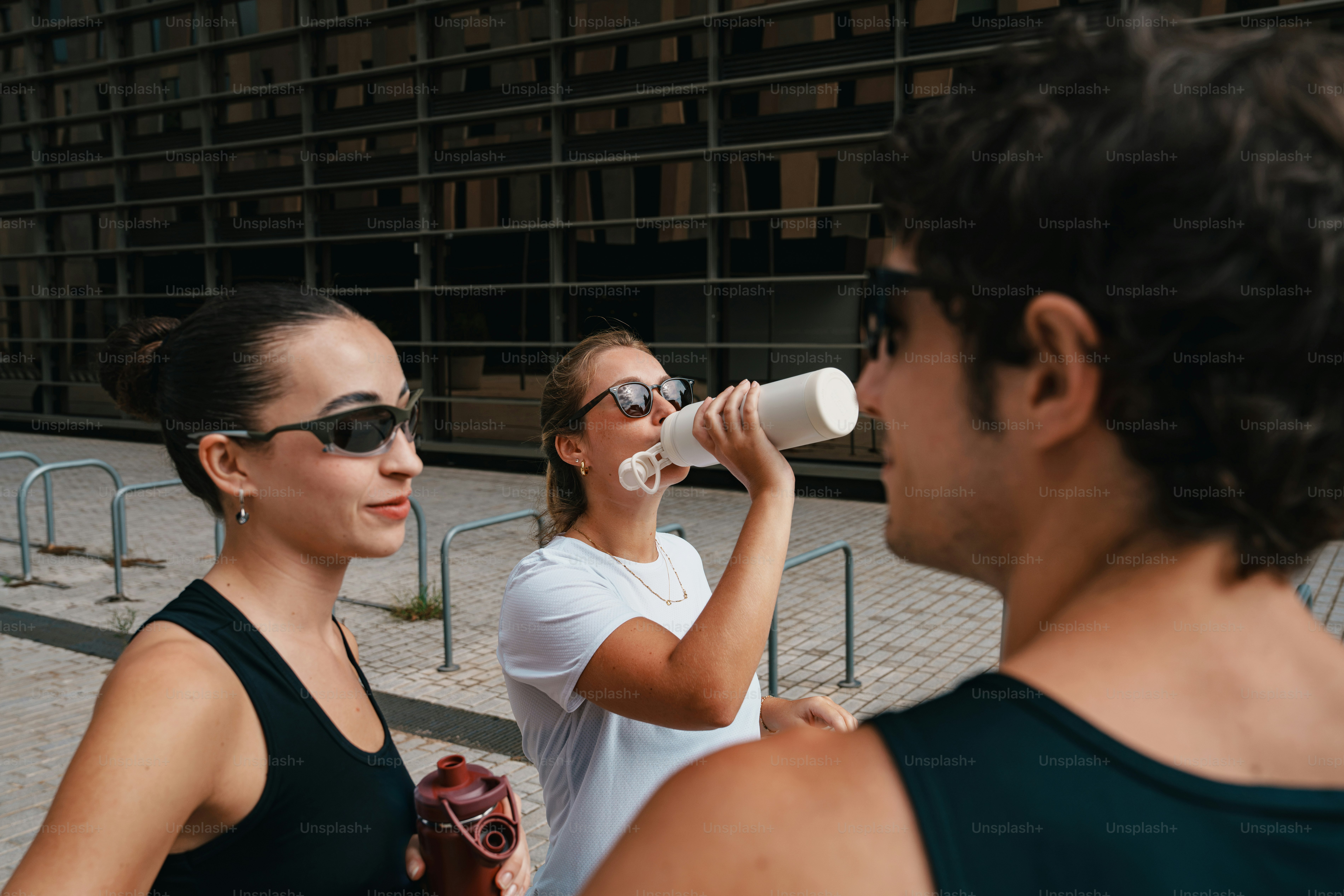 Three people in athletic wear - Photo on Unsplash+