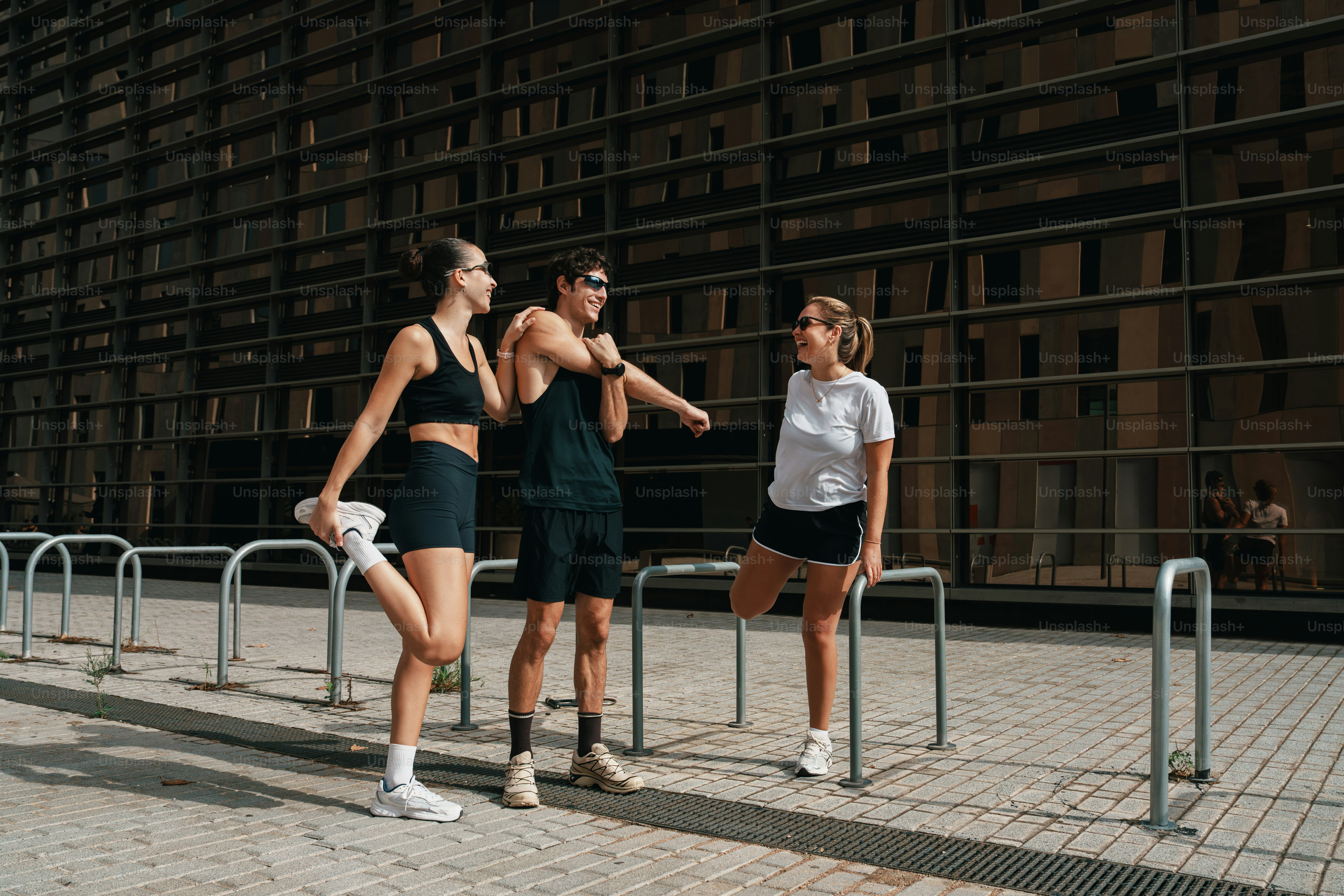 Three people in athletic wear - Photo on Unsplash+