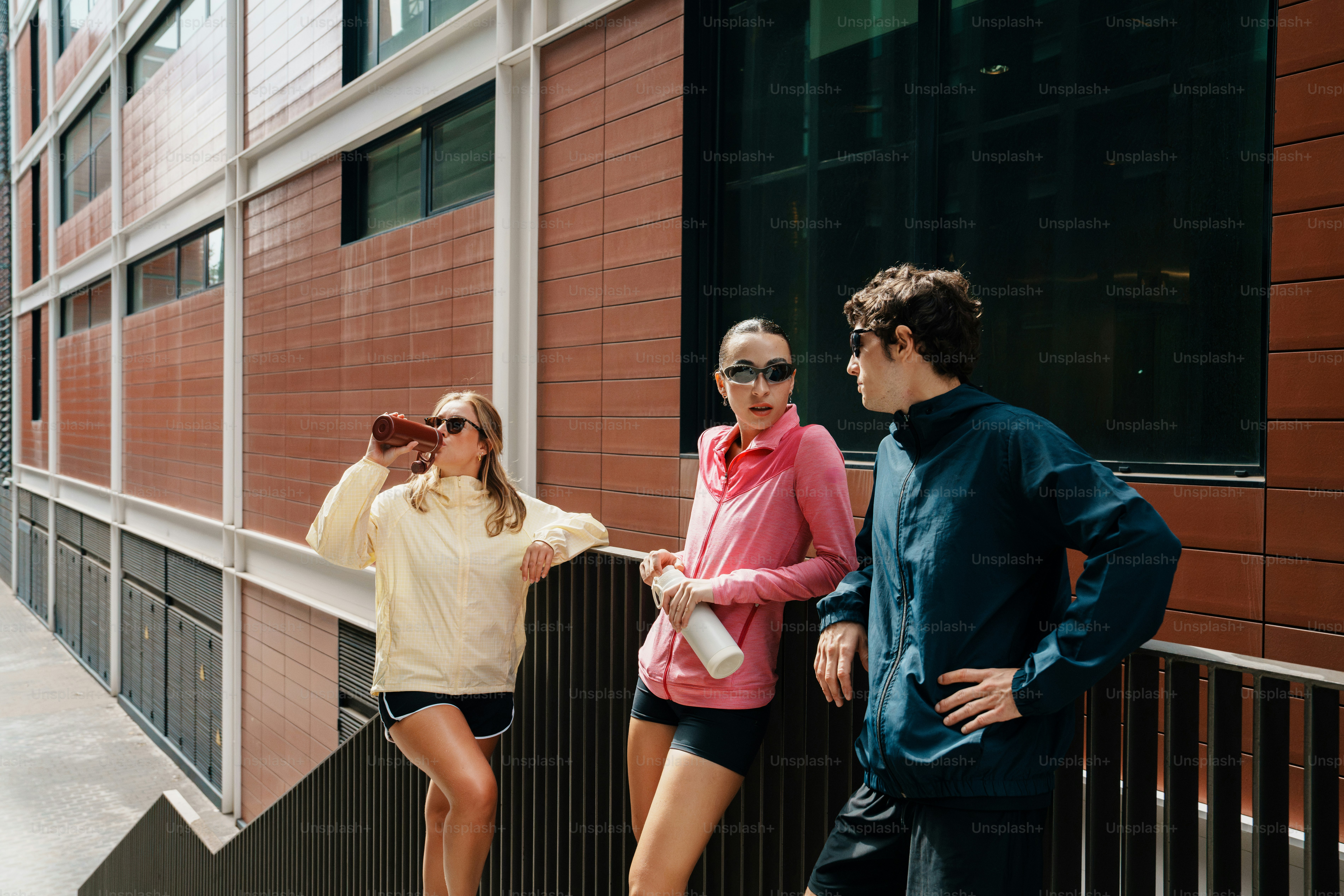 Three people in athletic wear - Photo on Unsplash+