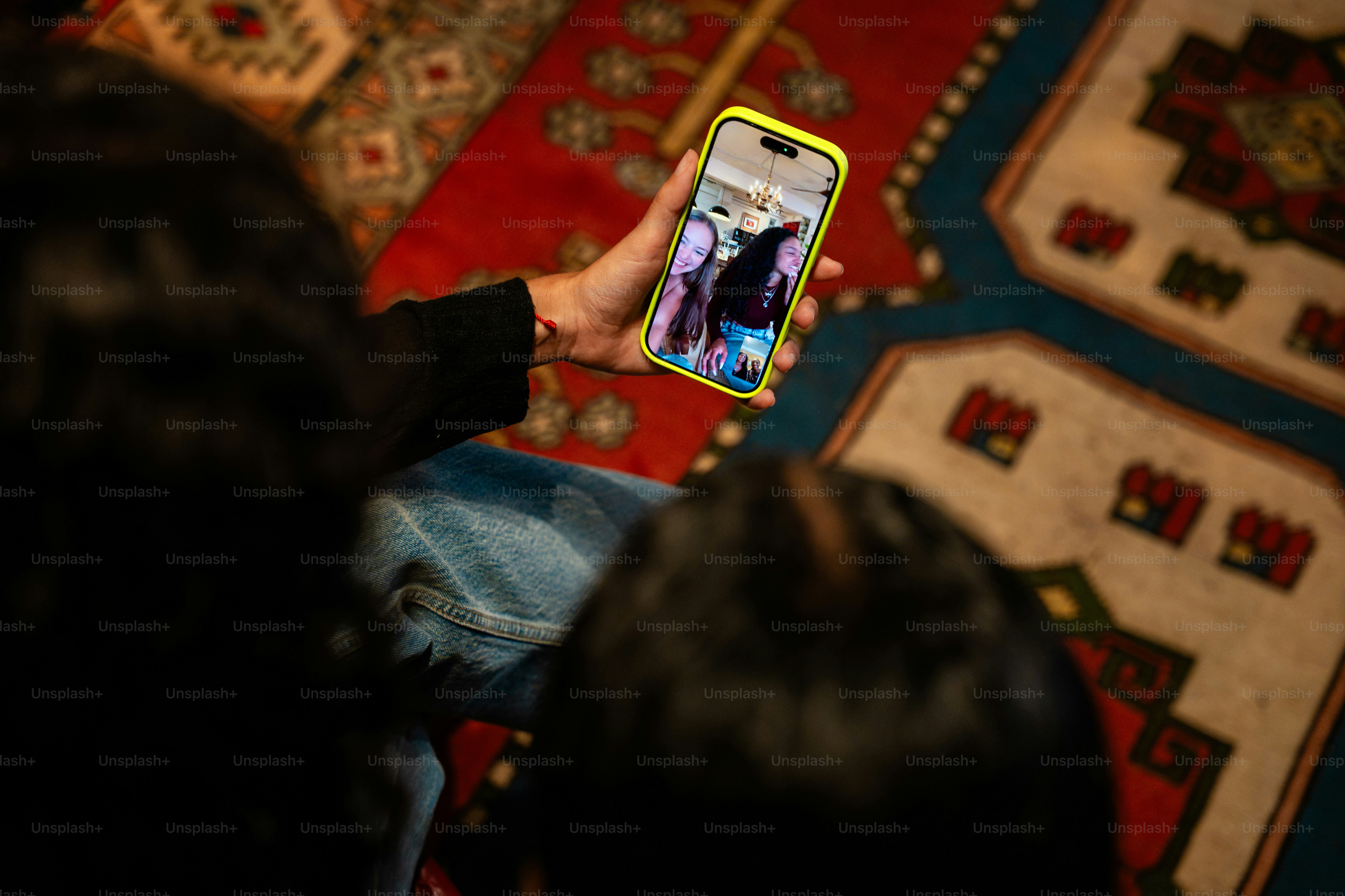 Person holding smartphone on video call - Photo on Unsplash+